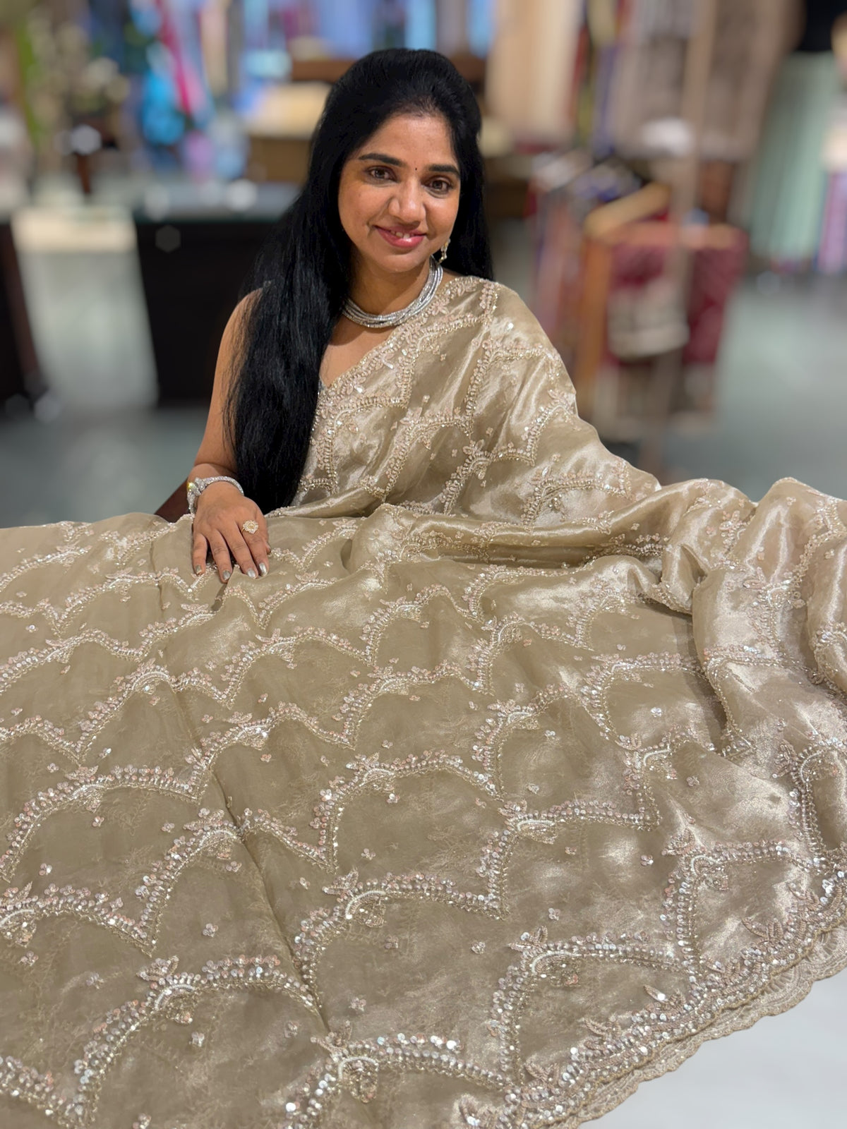 Nude tissue saree with heavy allover intricate handwork