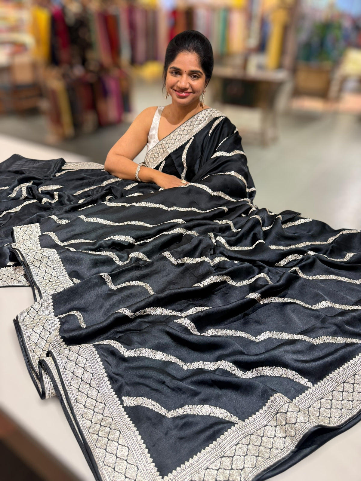 Black Designer Satin Saree with stunning embroidery paired with Silver tissue Pythani embroidered blouse