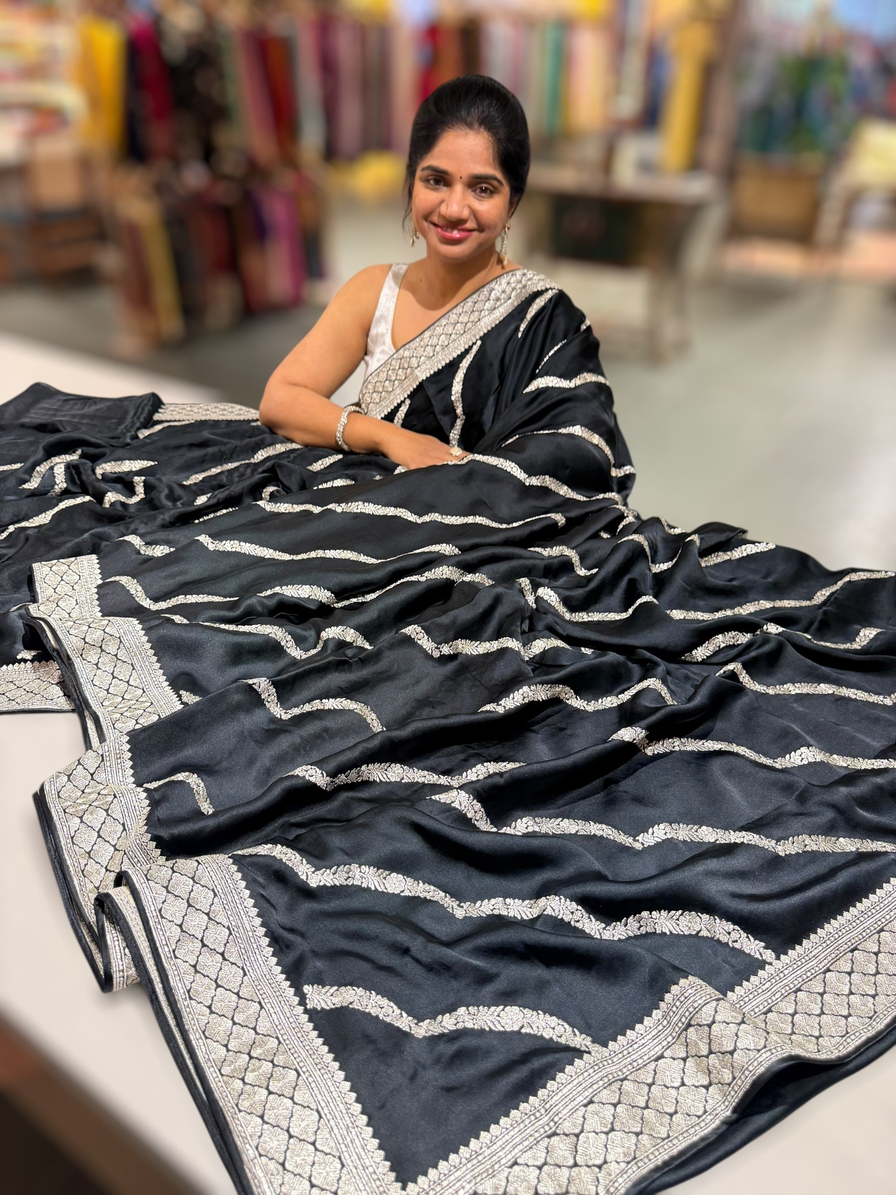 Black Designer Satin Saree with stunning embroidery paired with Silver tissue Pythani embroidered blouse