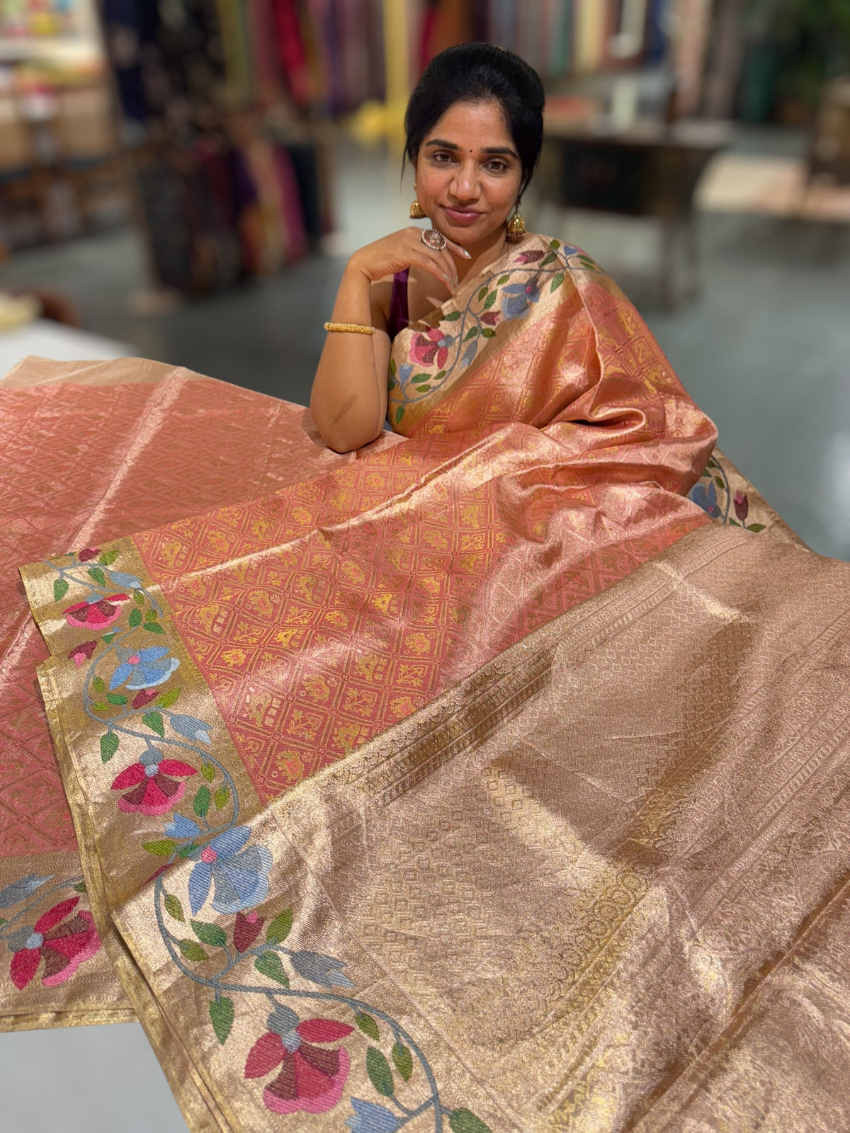 Coral Peach Kanchi Tissue Brocade Saree With jamdani inspired embroidery.