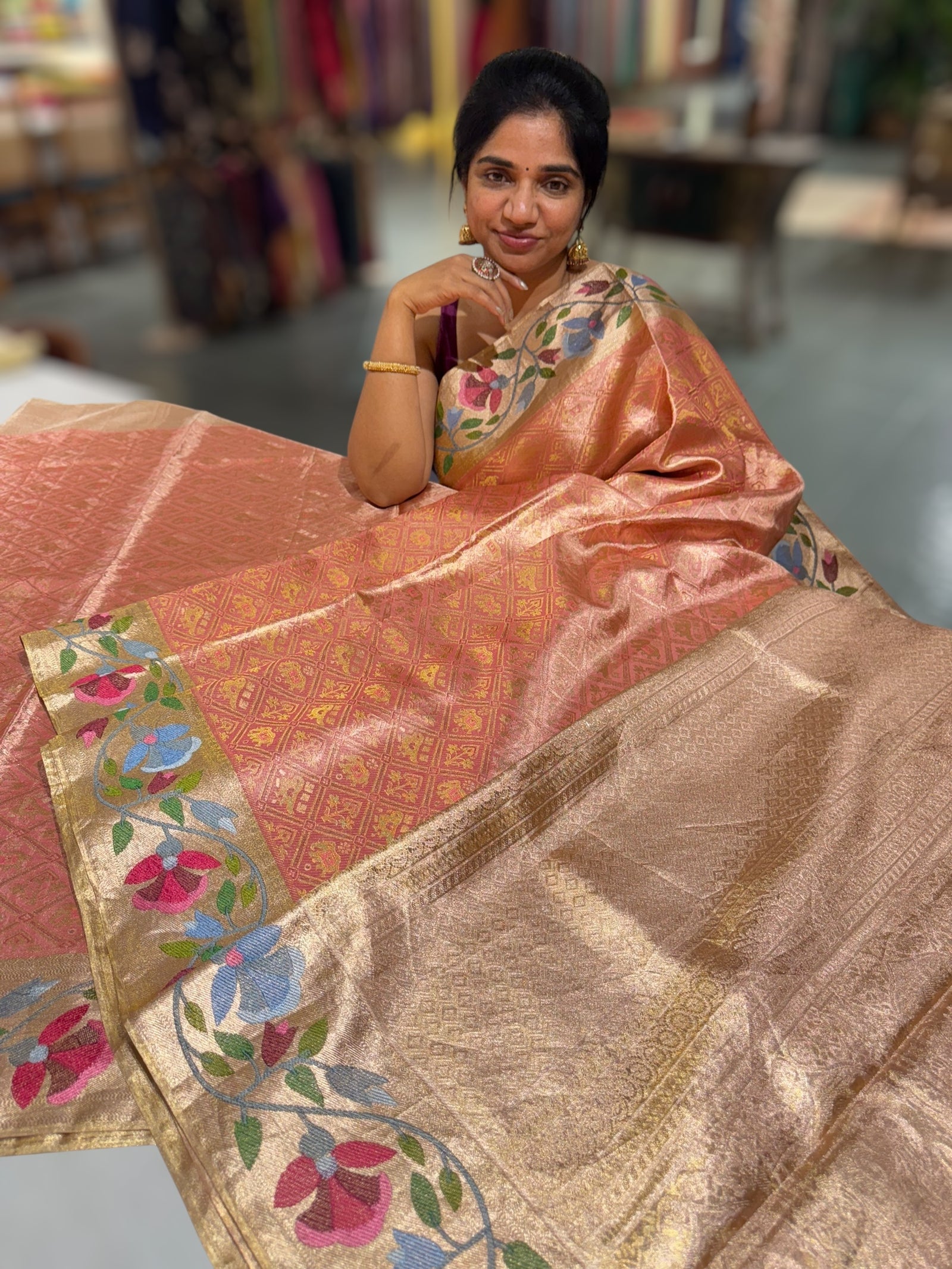Coral Peach Kanchi Tissue Brocade Saree With jamdani inspired embroidery.