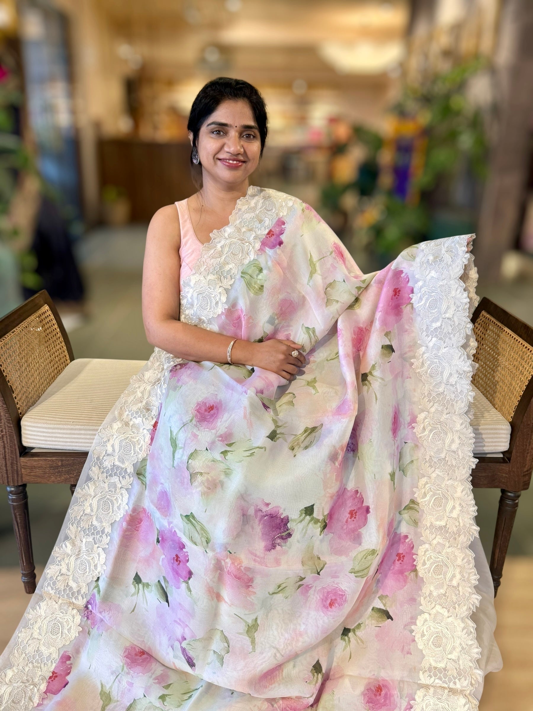 Ivory Printed Organza Saree With Chantilly Lace Style Embroidered Border.