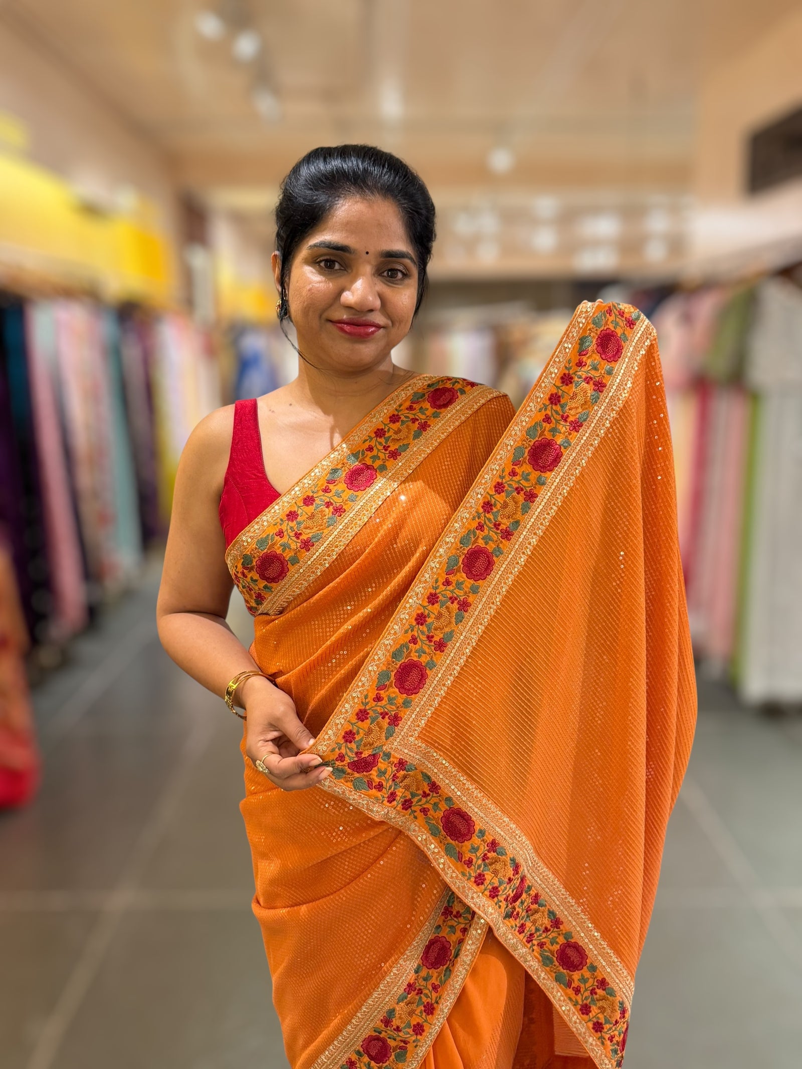 Orange Georgette sequnce Saree with Sabyasachi borders