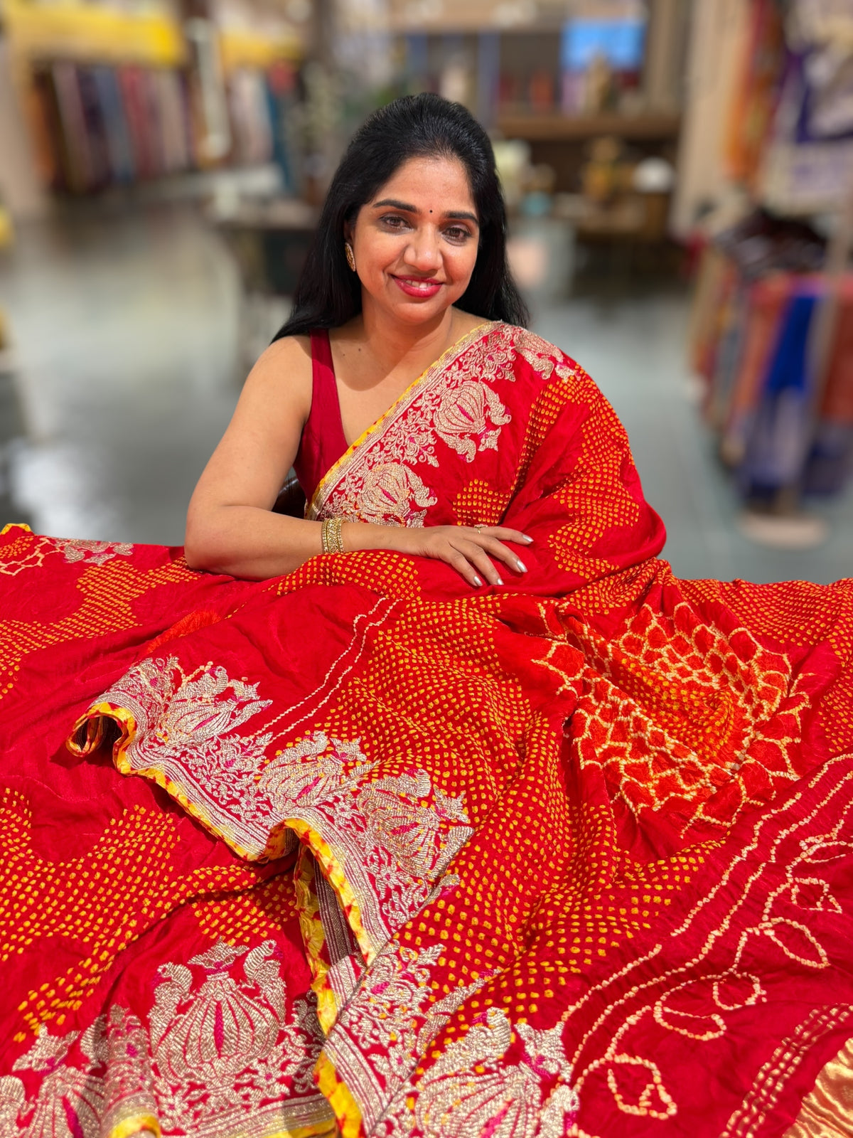 Reddish Orange Designer Rai Bandhej Saree With Embroidered Border