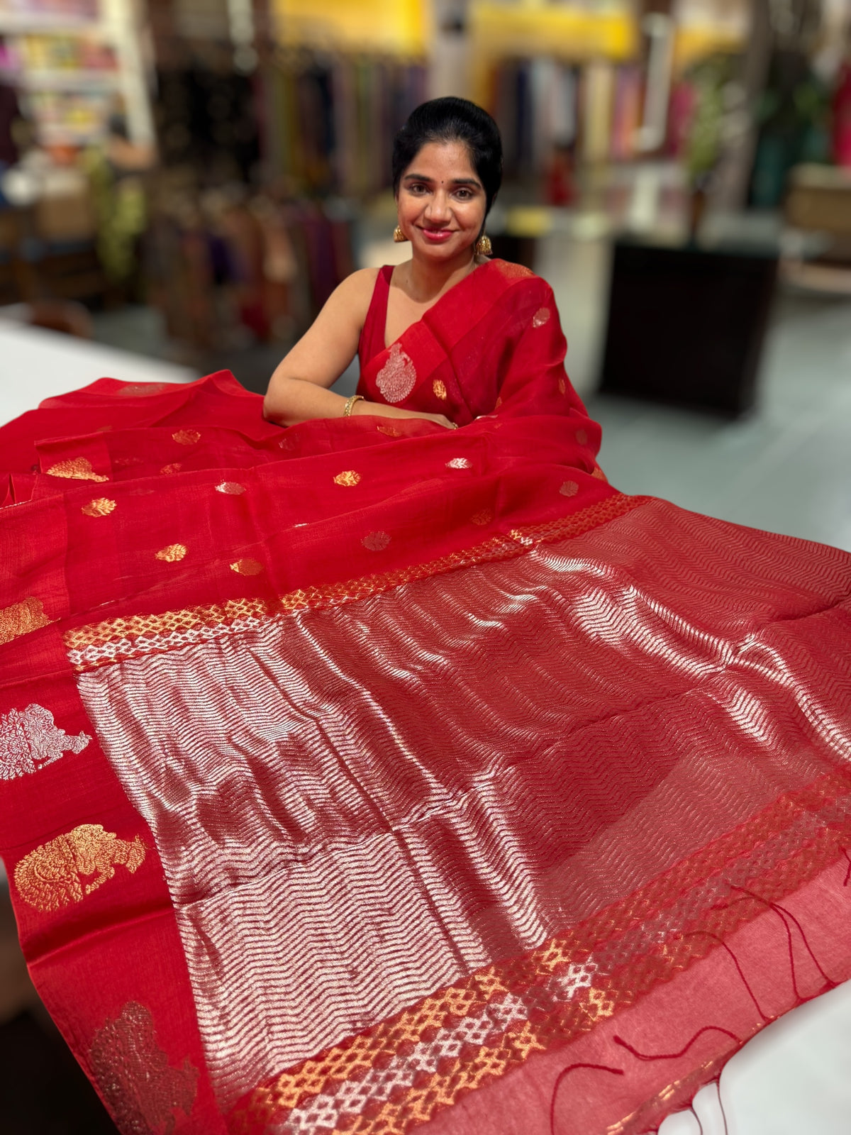 Red kora muslin sarees with kaduwa woven nandi motif border