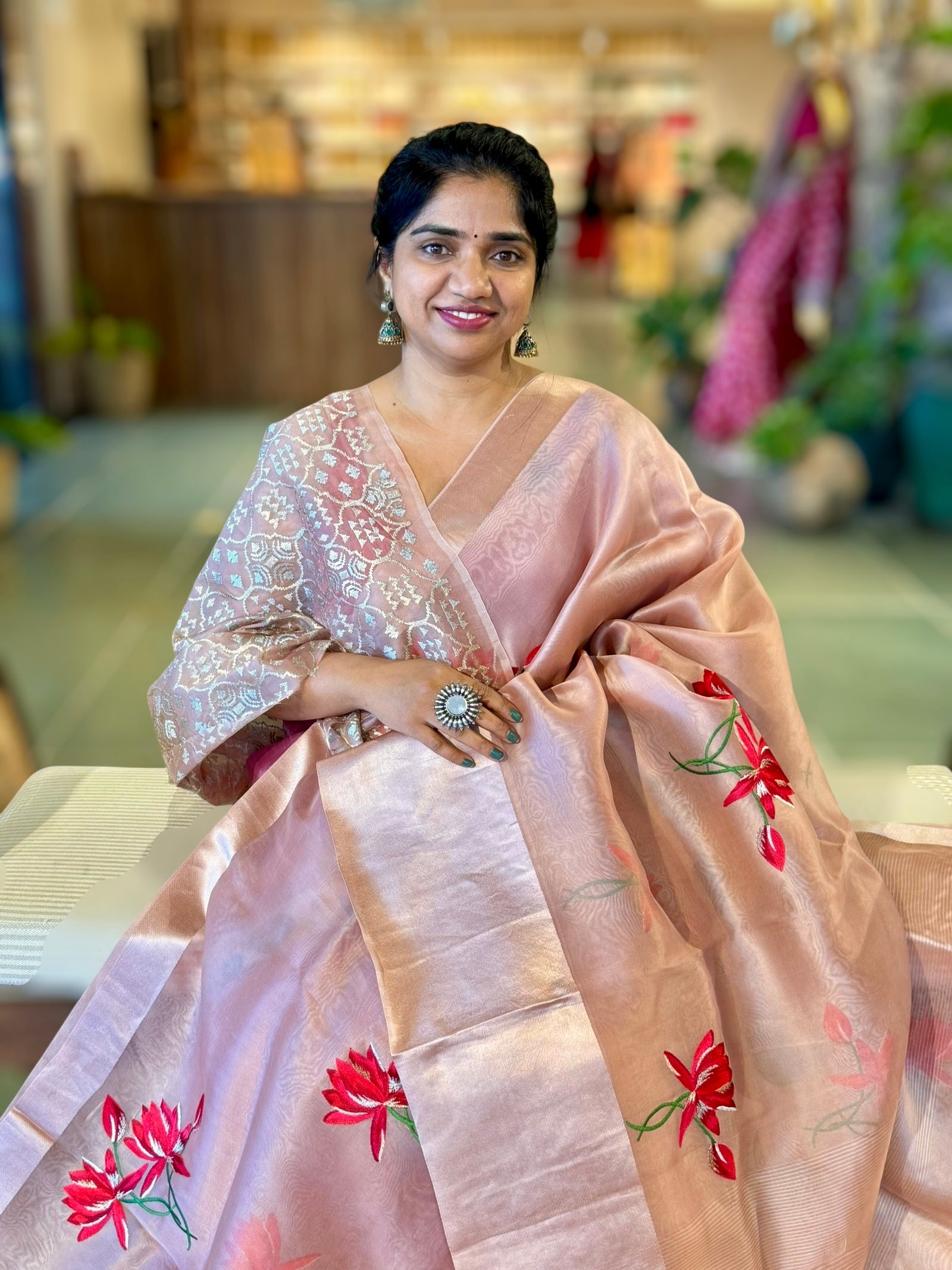 Onion Pink Organza Saree with Lotus flower embroidery and Satin Borders.