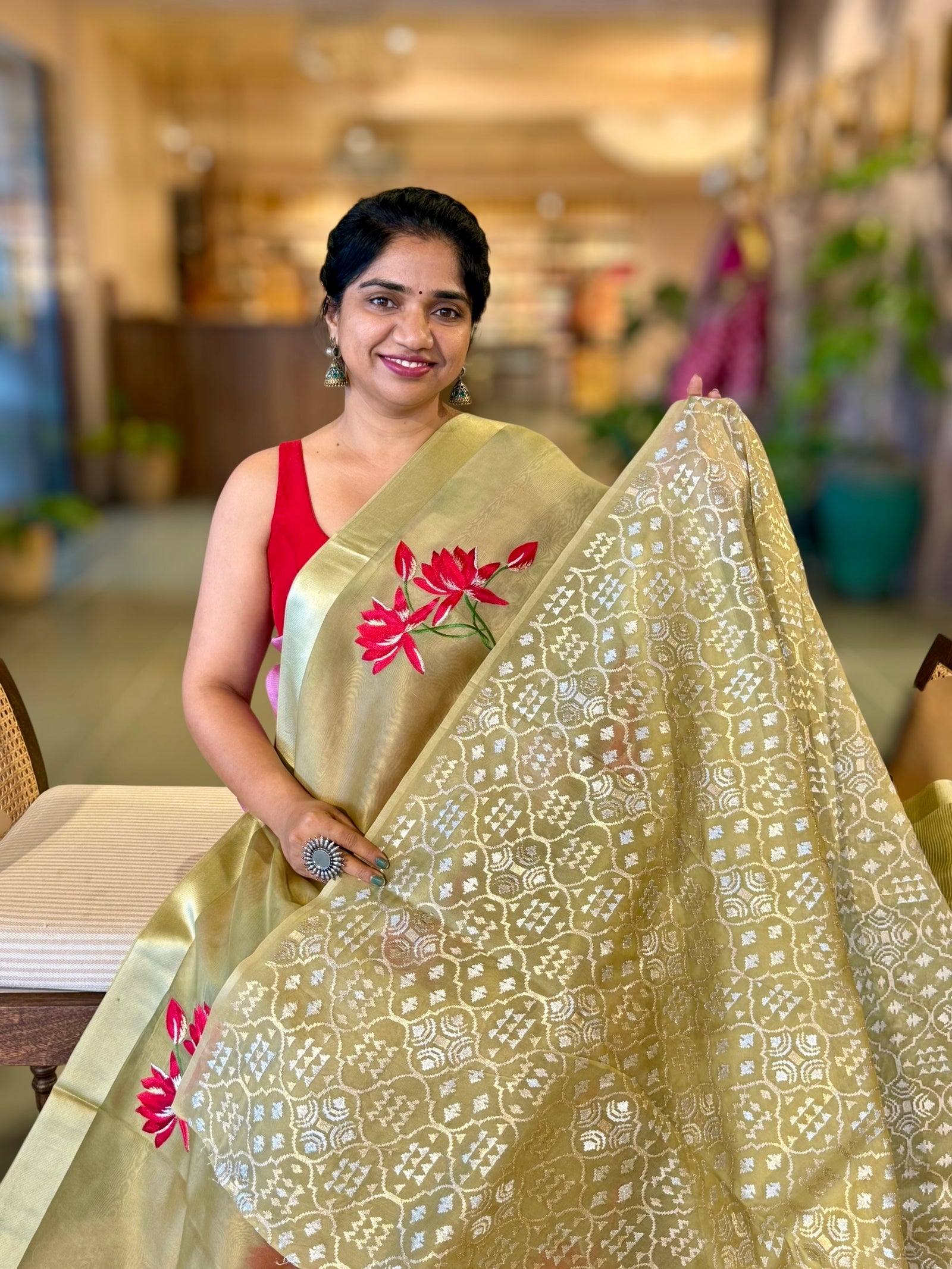 Olive Green Organza Saree with Lotus flower embroidery and Satin Borders.