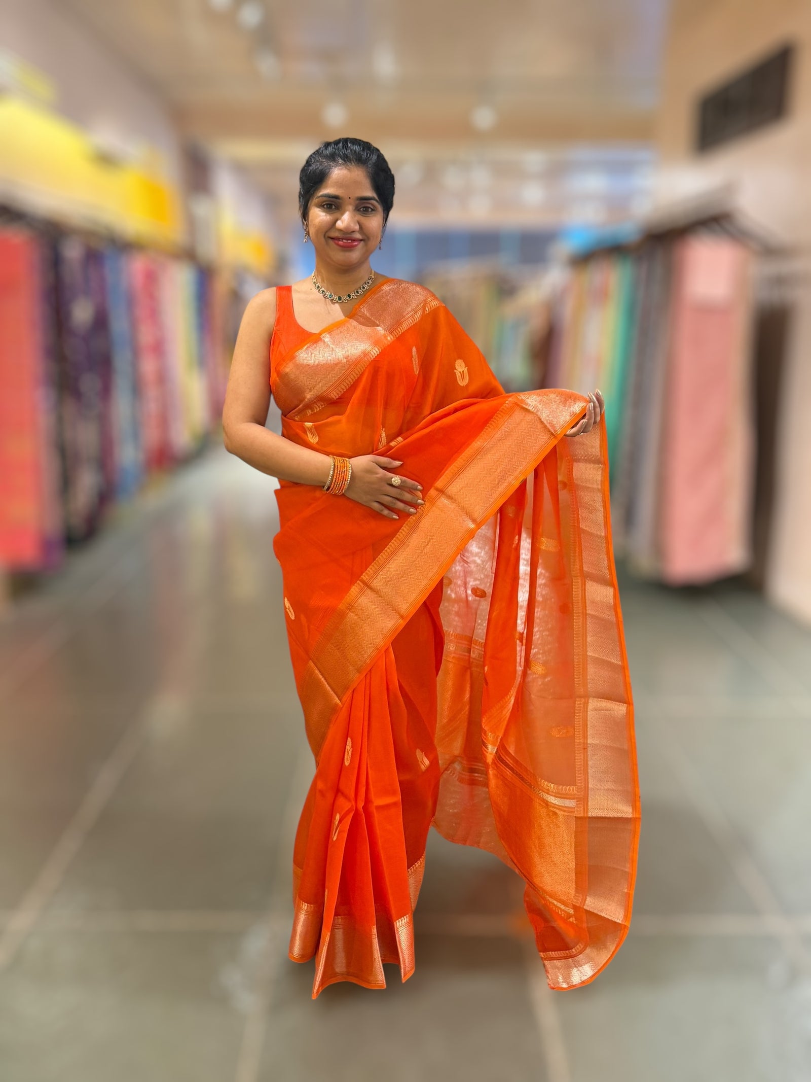 Orange Premium Kora Banarasi Saree with heavy weaving borders and Raw mango style motifs