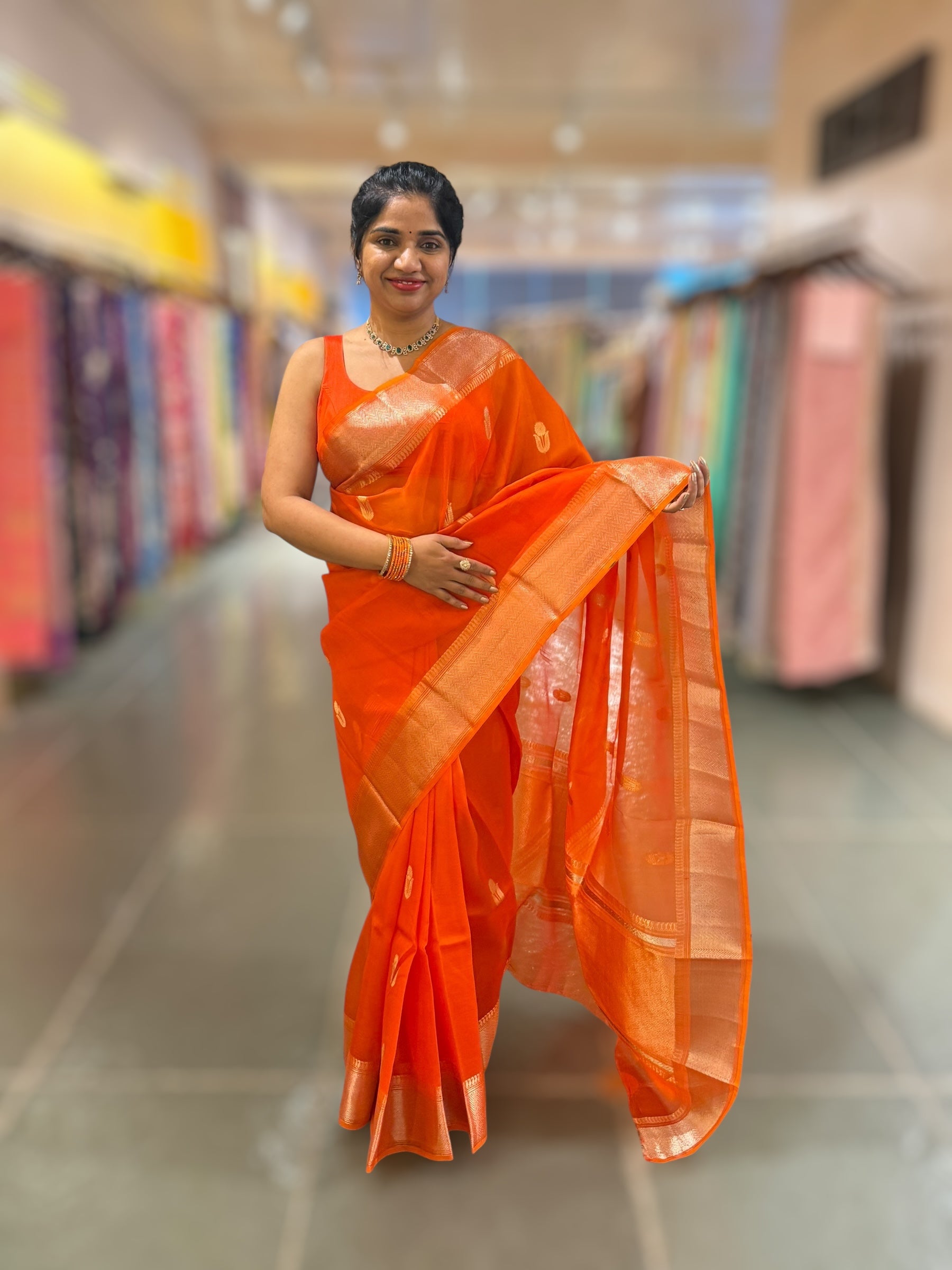 Orange Premium Kora Banarasi Saree with heavy weaving borders and Raw mango style motifs