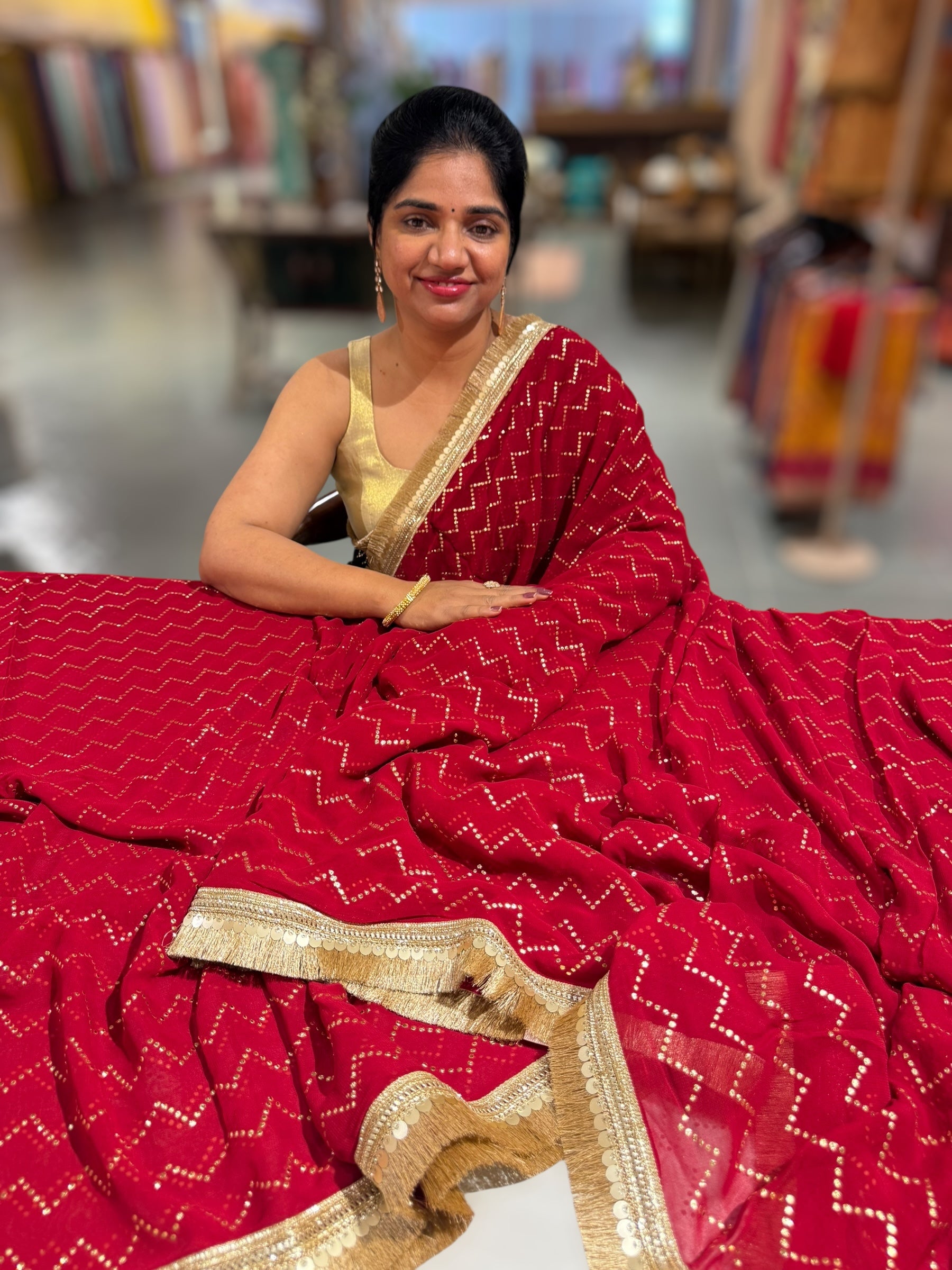 Dark Red Georgette Saree with stick on Badla in zigzag pattern