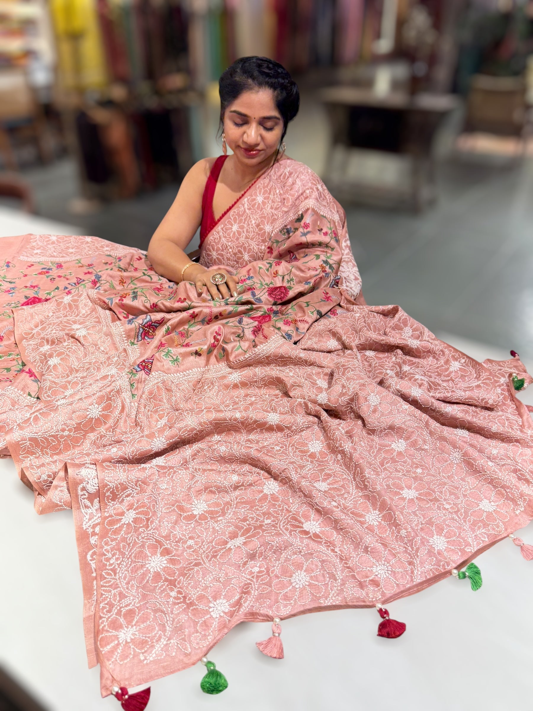 Peach Pink Tussar Saree with lucknowi border and pallu with allover petite point embroidery.