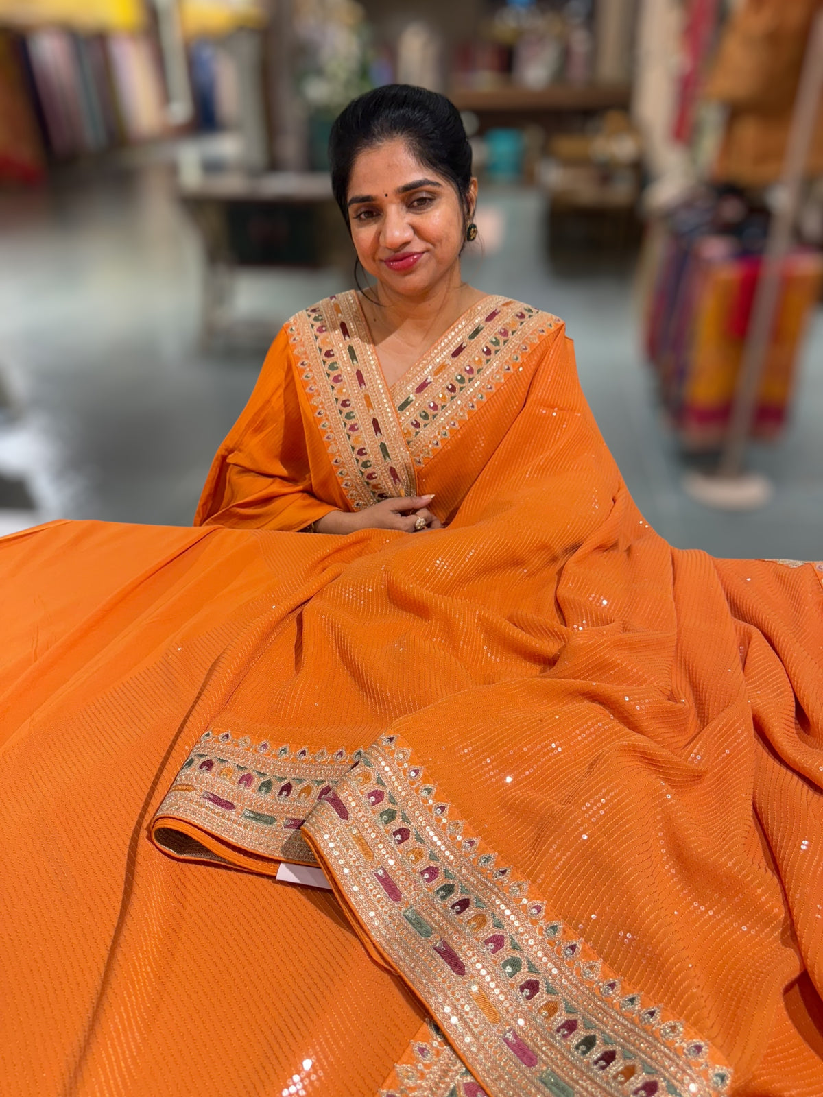 Orange Georgette sequnce Saree with Sabyasachi borders