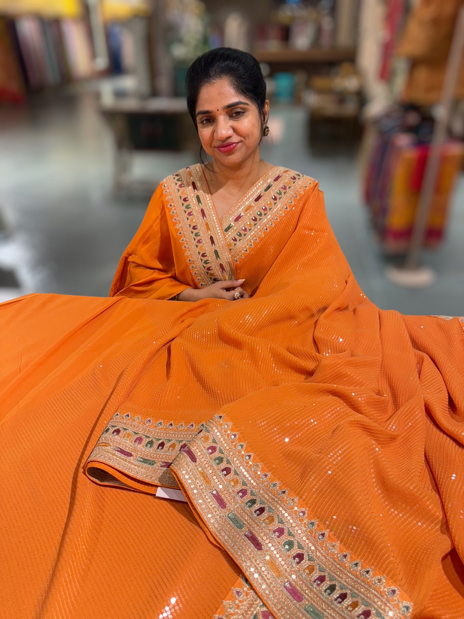 Orange Georgette sequnce Saree with Sabyasachi borders