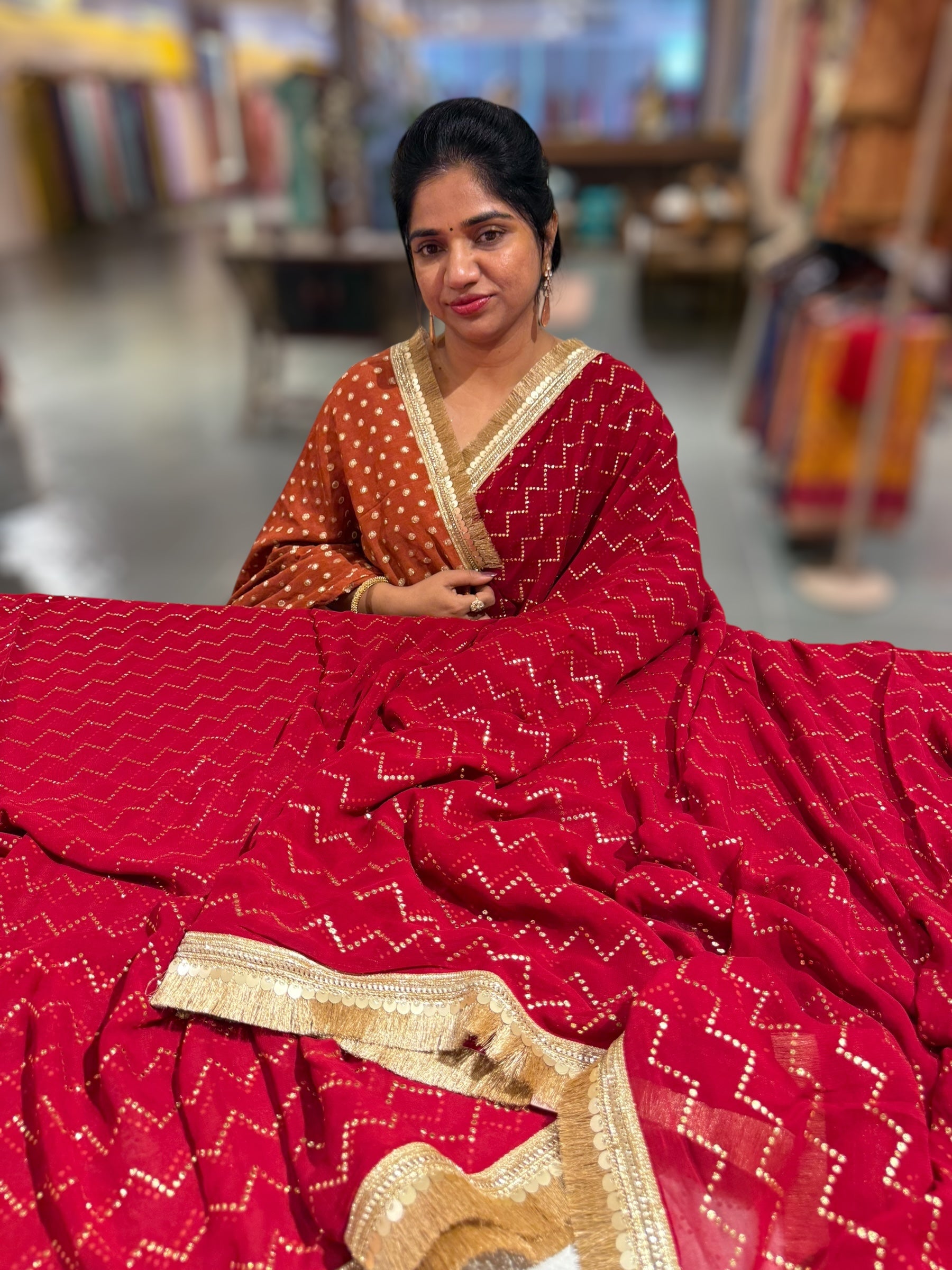 Dark Red Georgette Saree with stick on Badla in zigzag pattern