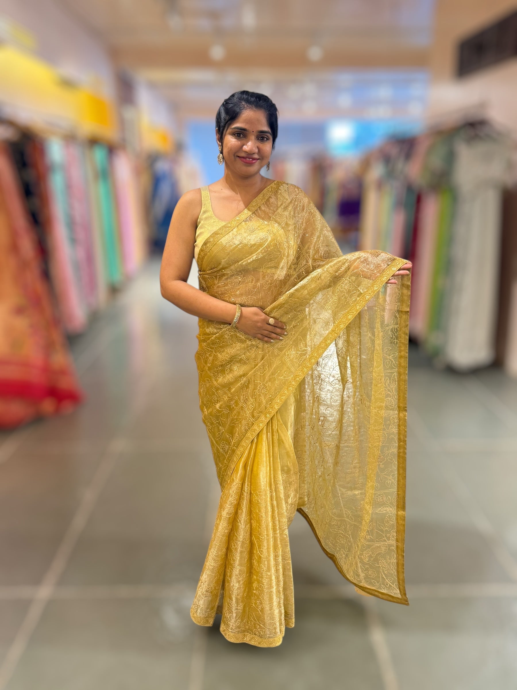 Yellow gold Tissue saree with Allover zari embroidery hemlined with sabyasachi borders & paired with pen kalamkari blouse