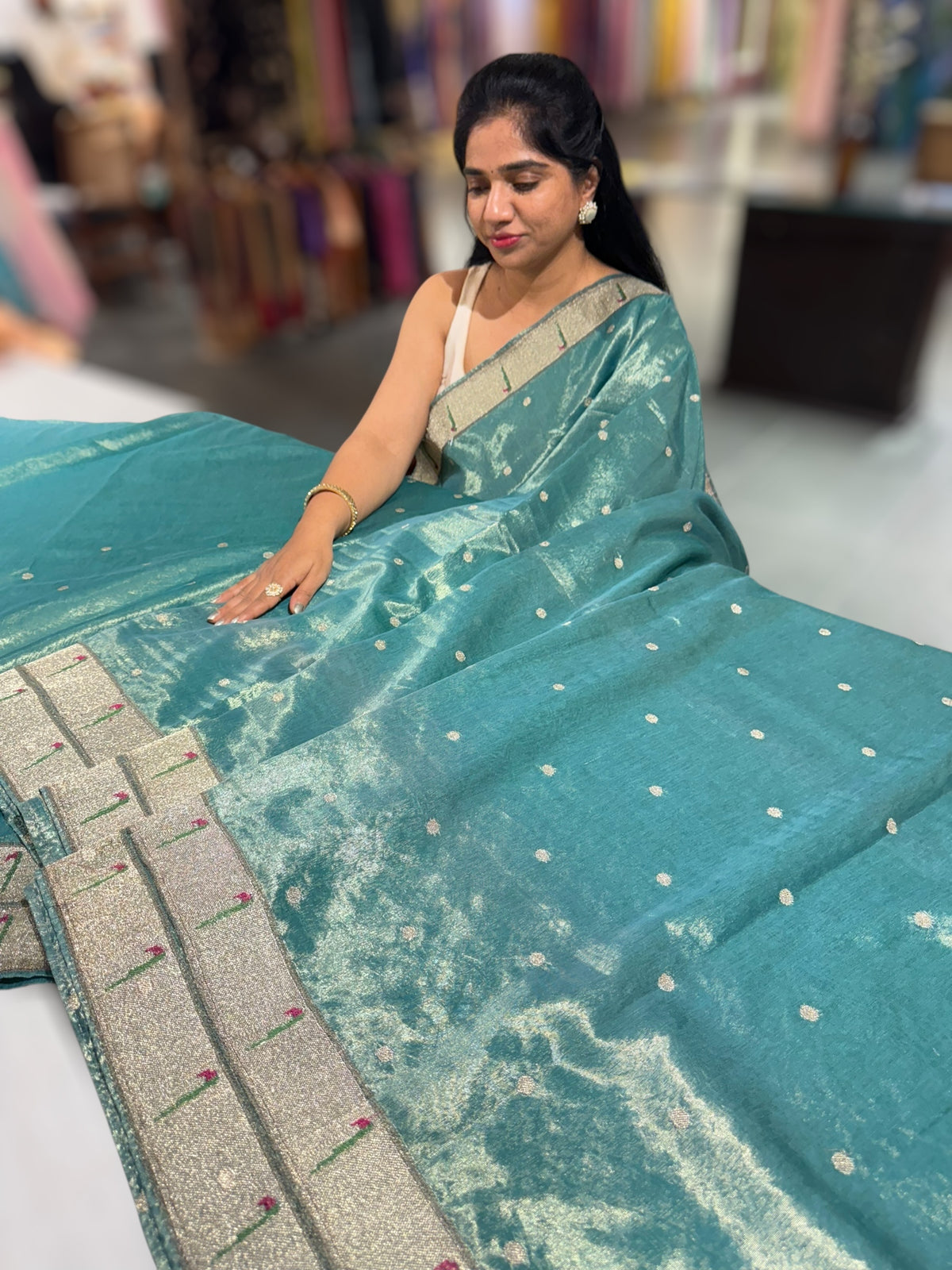 Teal Tissue Saree with pythani inspired muniya borders