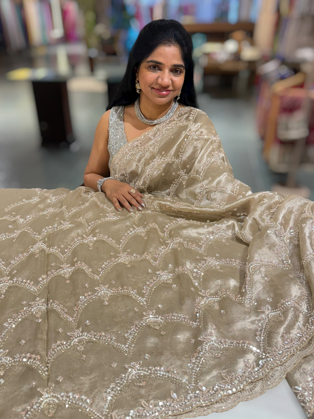 Nude tissue saree with heavy allover intricate handwork