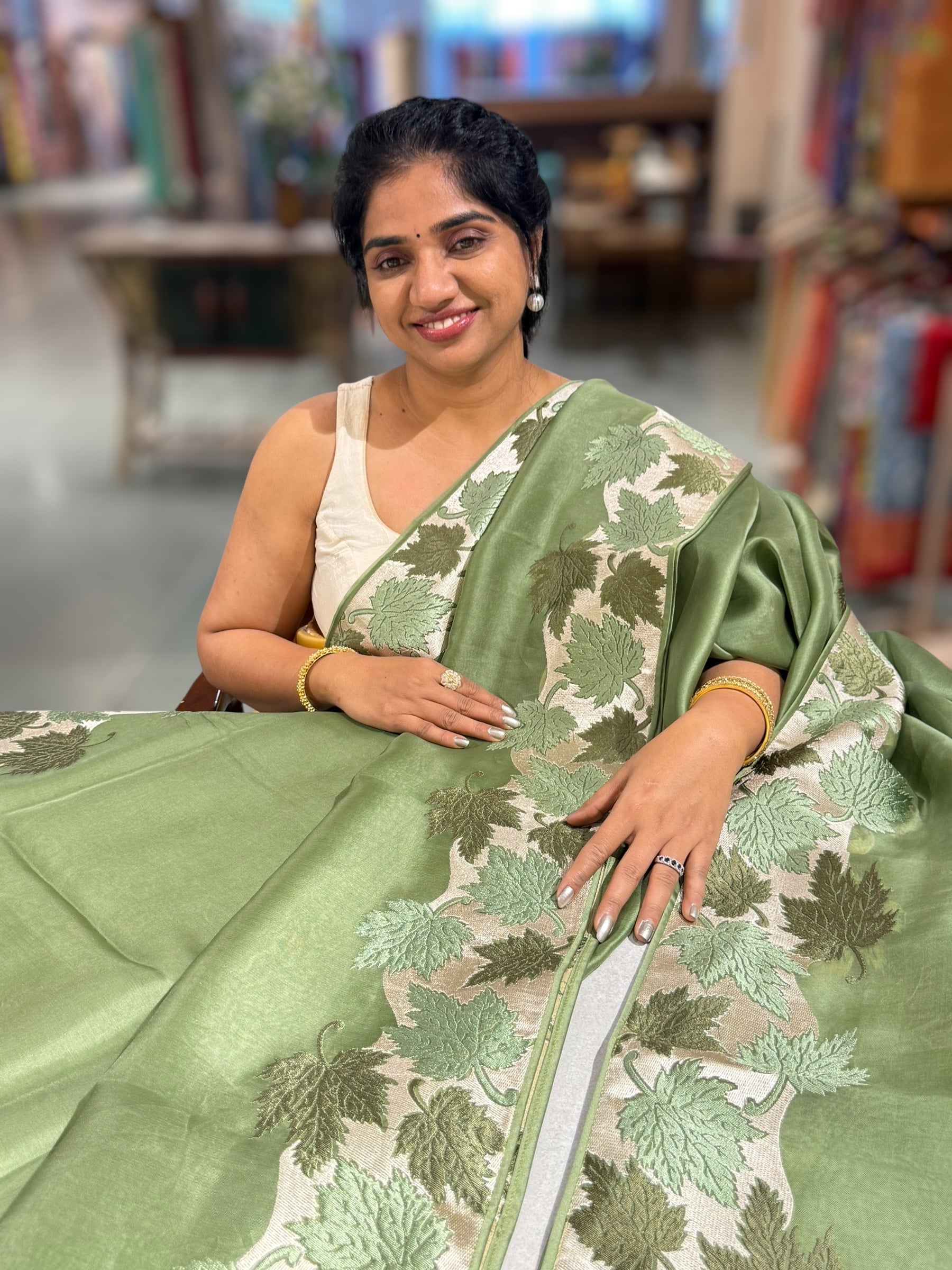 Sage Green Organza Saree with Stunning Leaf Embroidered Border