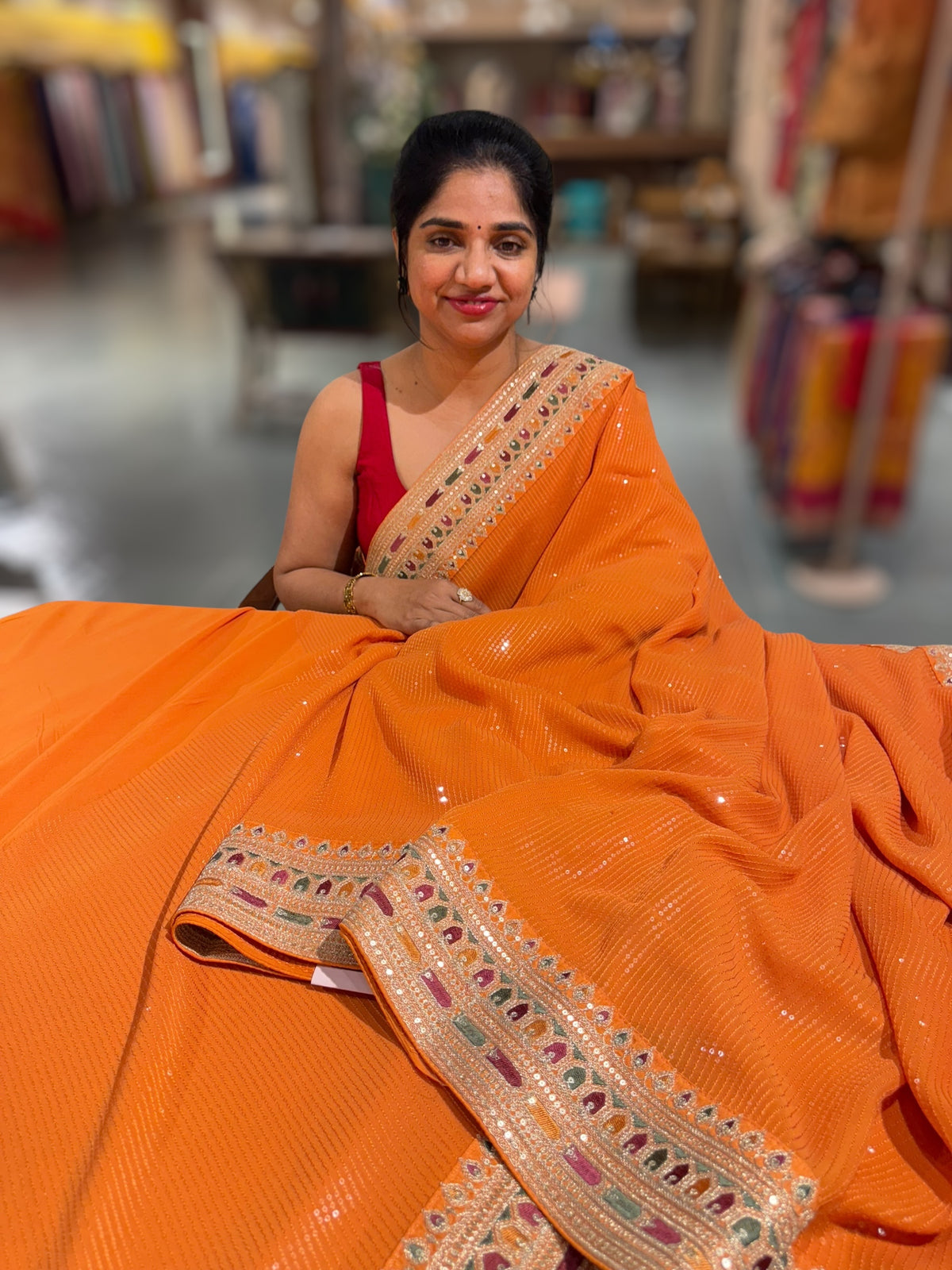 Orange Georgette sequnce Saree with Sabyasachi borders
