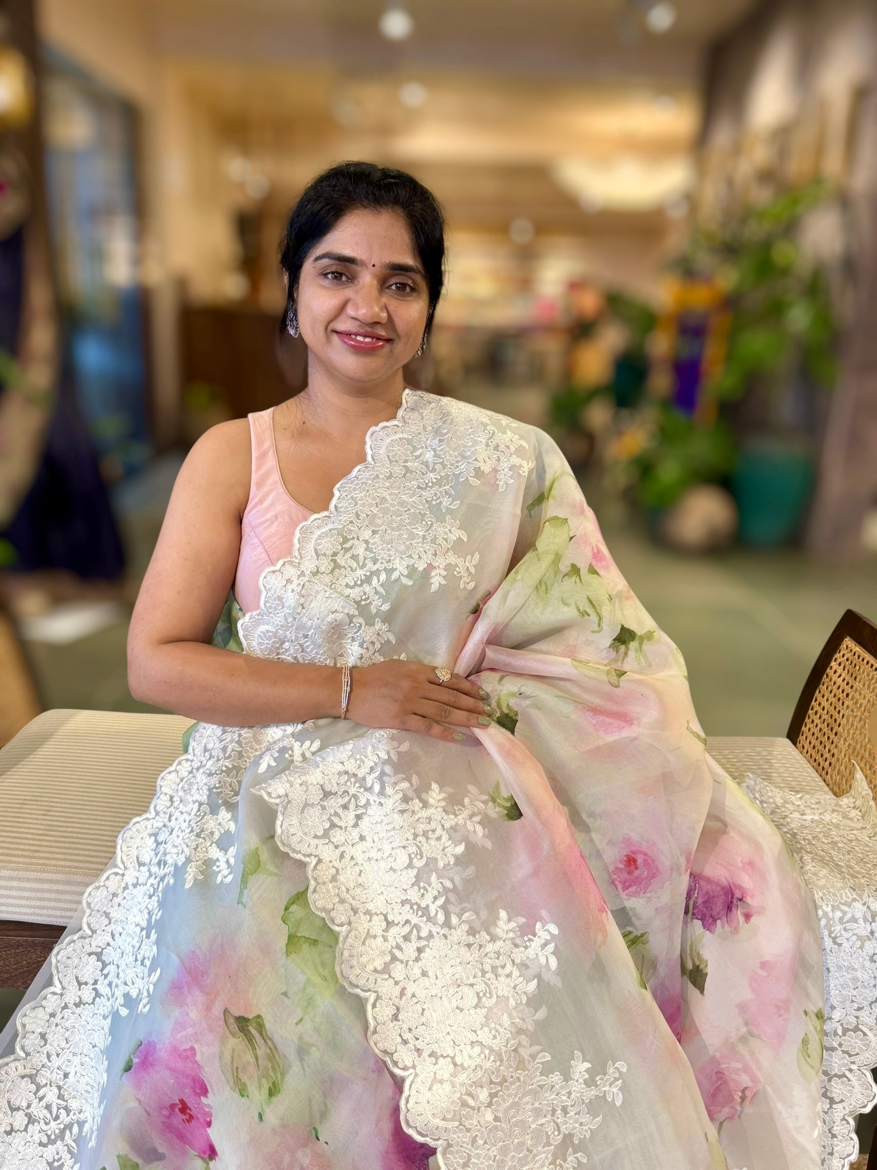 Ivory Printed Organza Saree With Chantilly Lace Style Embroidered Border.