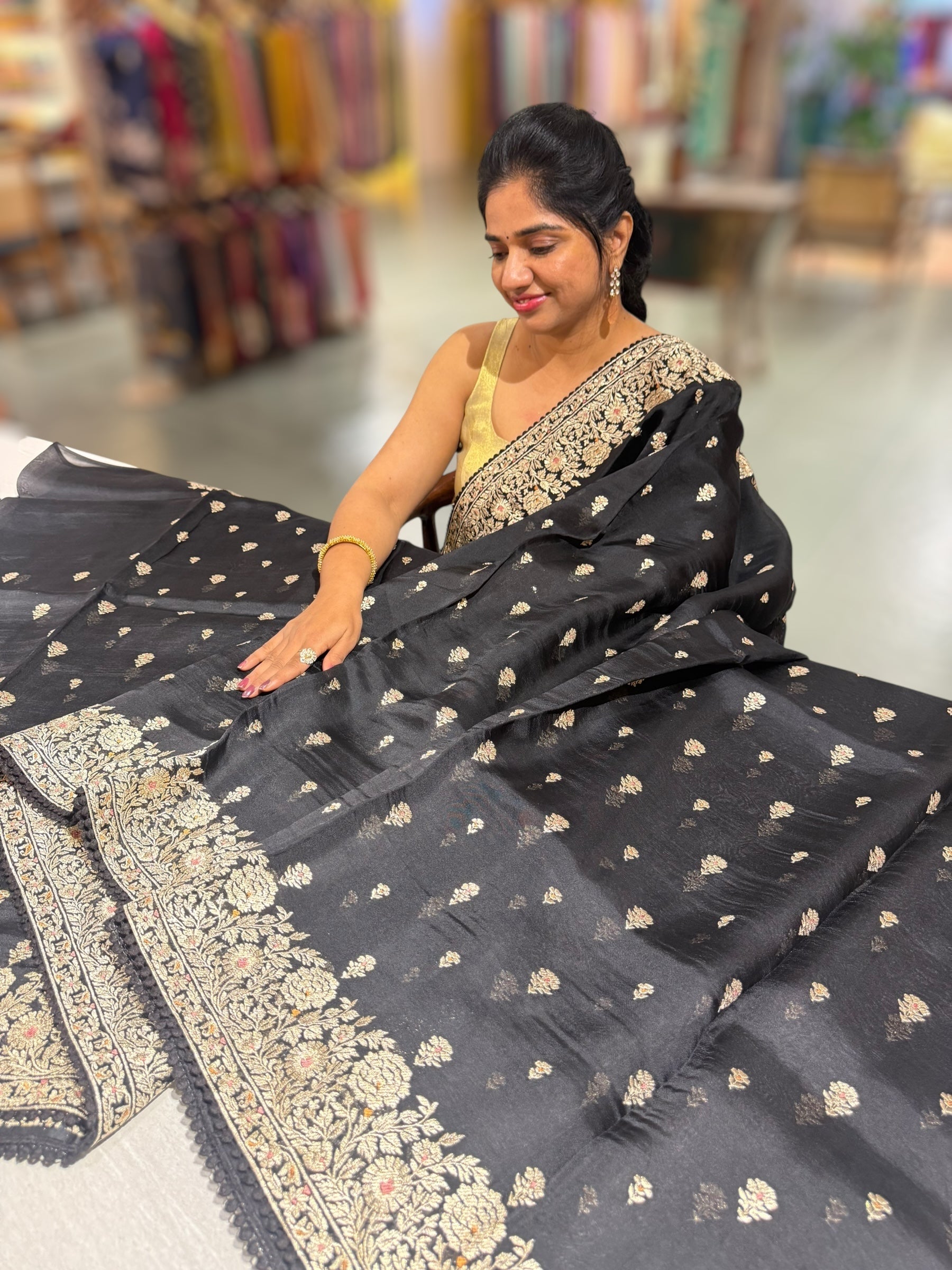 Black Organza Saree with stunning heavy zari embroidered border and alloevr motifs