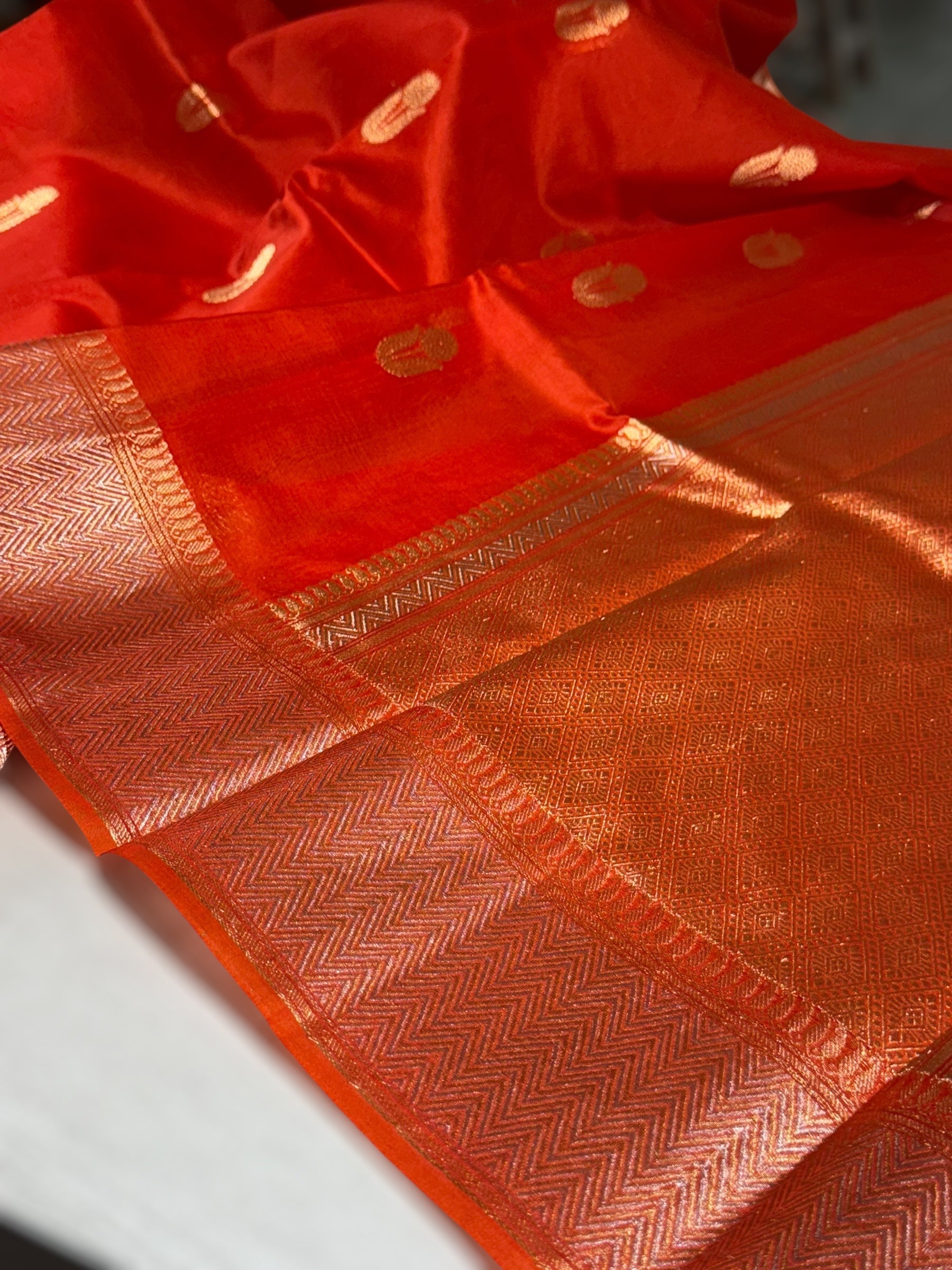 Dark Orange Premium Kora Banarasi Saree with heavy weaving borders and Raw mango style motifs