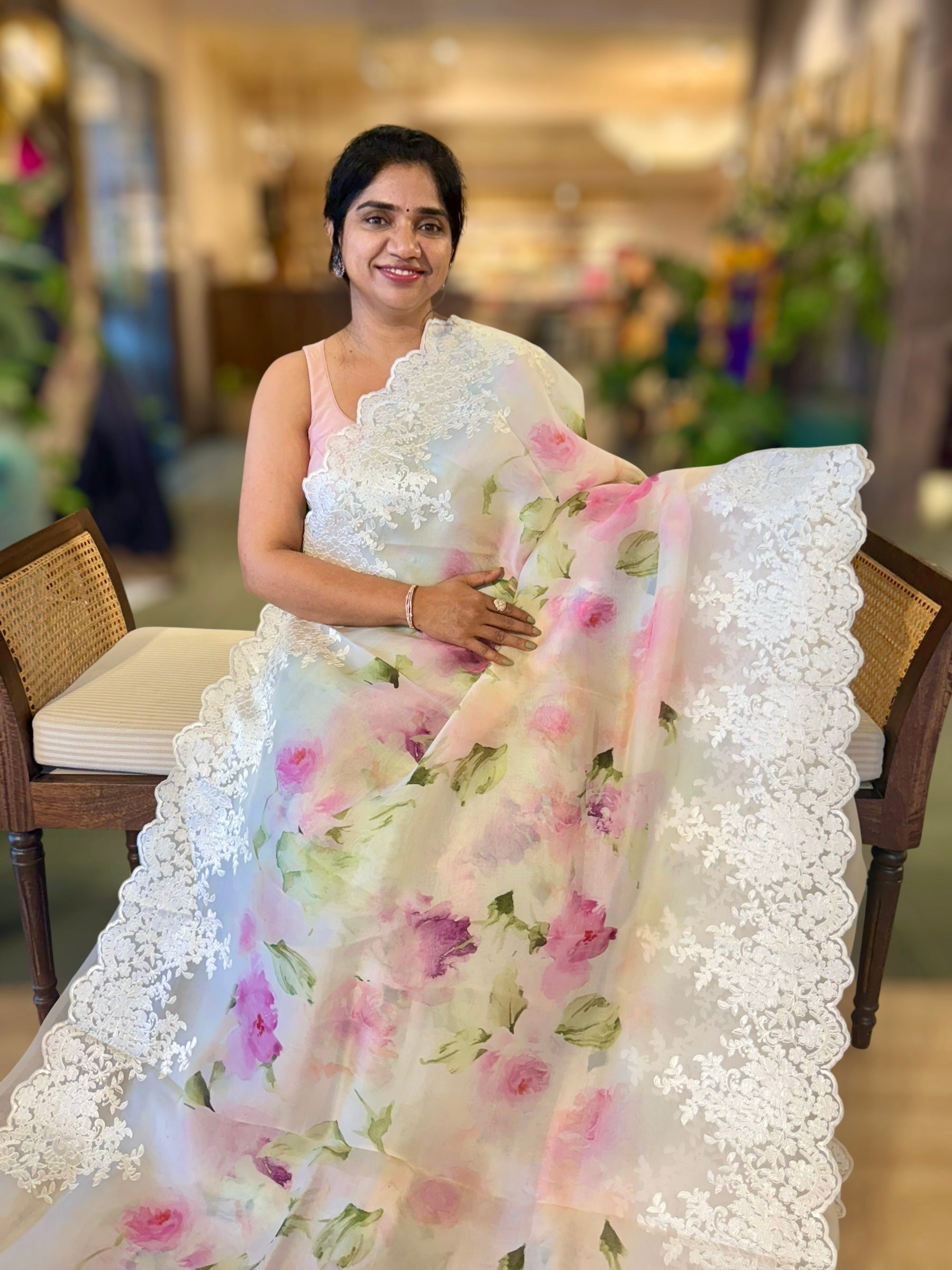 Ivory Printed Organza Saree With Chantilly Lace Style Embroidered Border.
