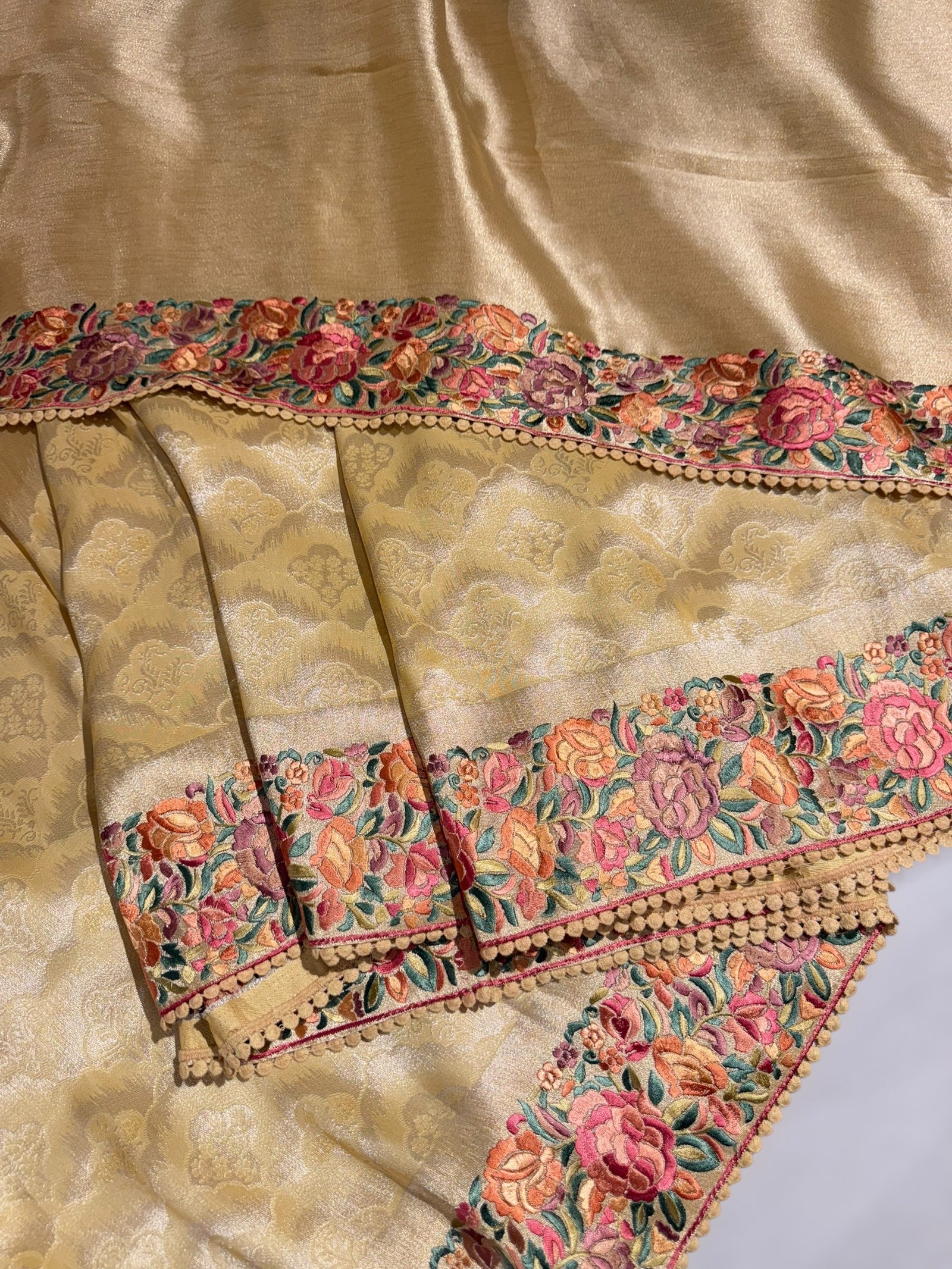 Pastel yellow Banarasi Brocade tissue saree with tonchui style weaving and parsi gara embroidered border
