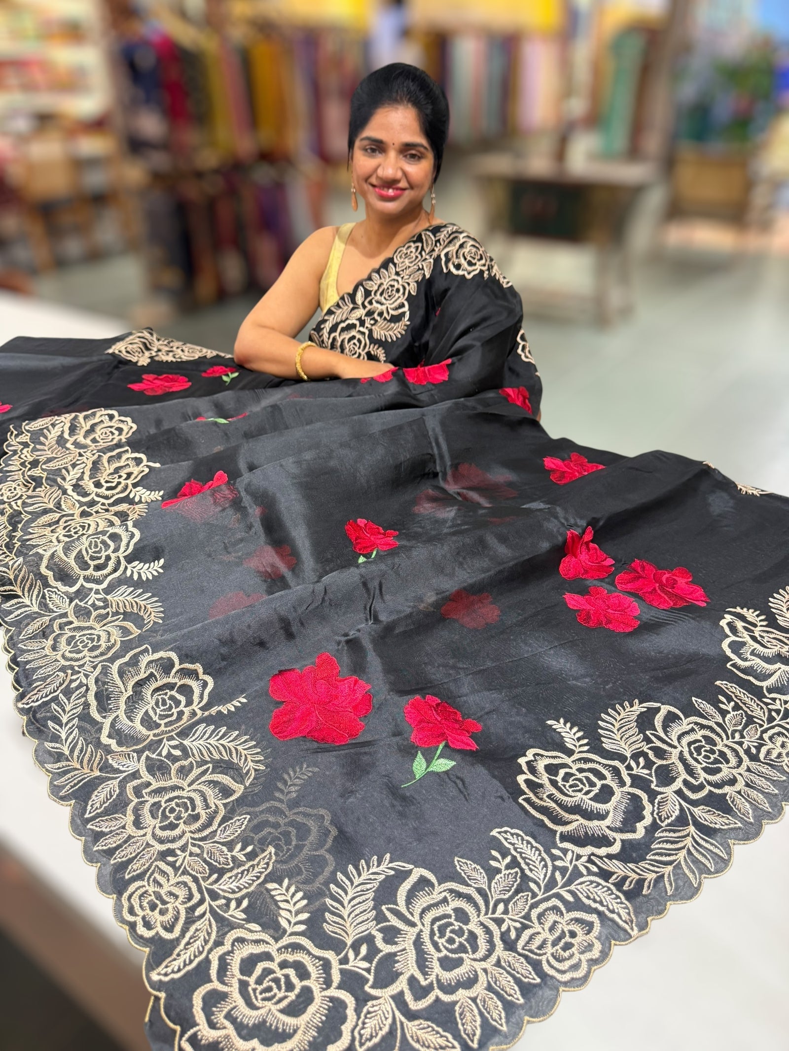 Black Organza Saree with stunning outline floral embroidered cytwork border and red hibuscus flowers allover