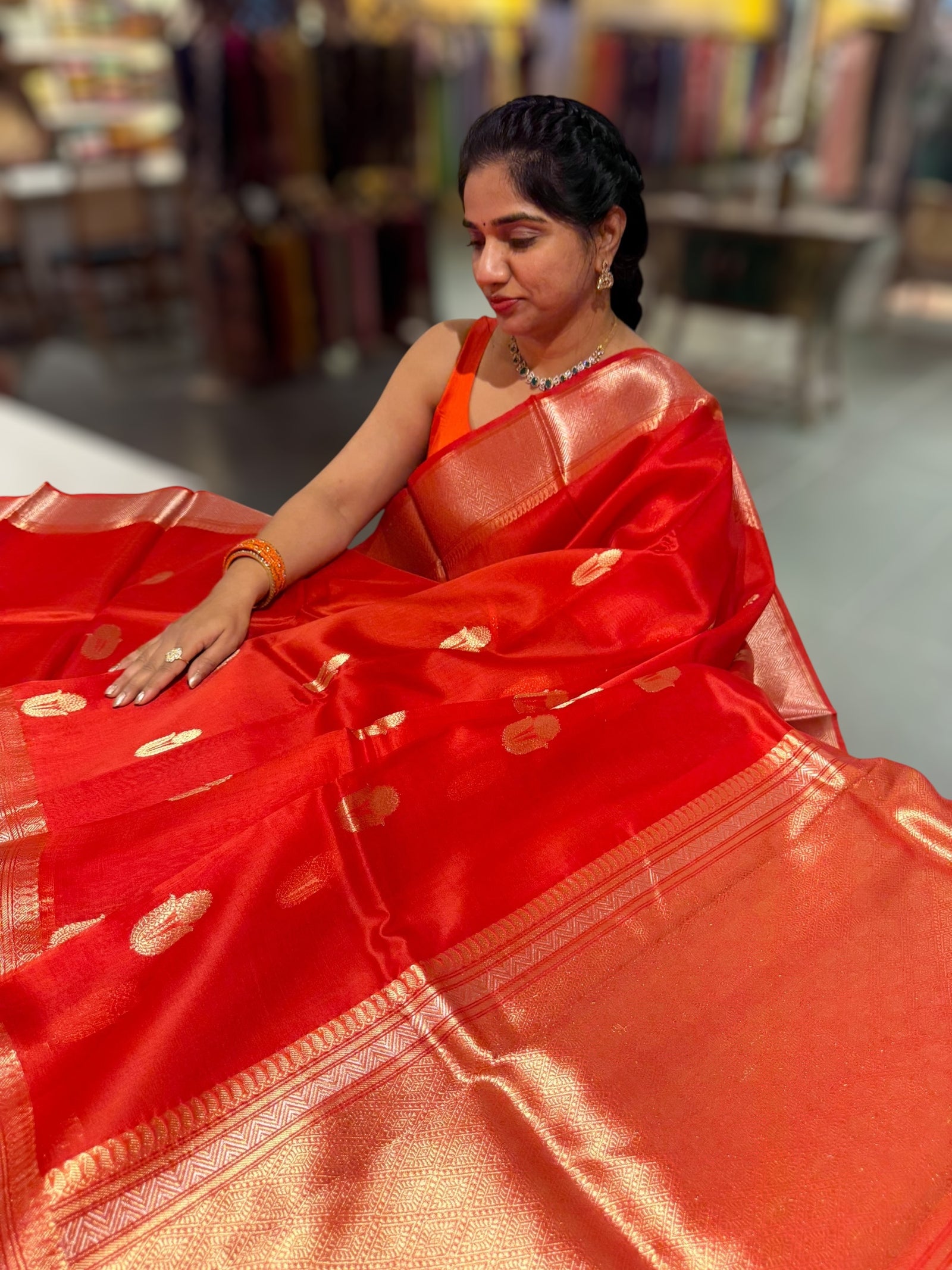 Orangish Red Premium Kora Banarasi Saree with heavy weaving borders and Raw mango style motifs