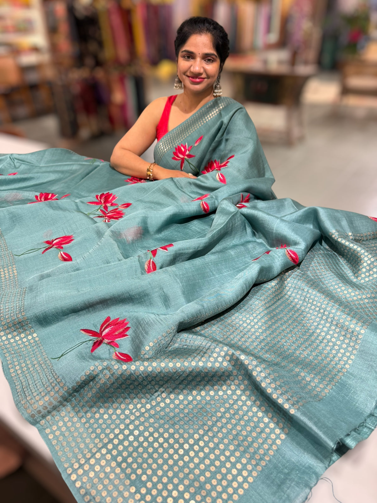 Teal pure handloom tussar byloom saree with lotus embroidered bunch motifs