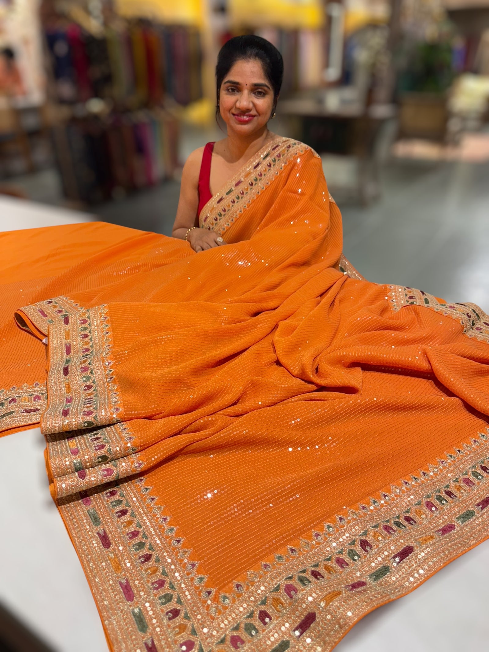 Orange Georgette sequnce Saree with Sabyasachi borders