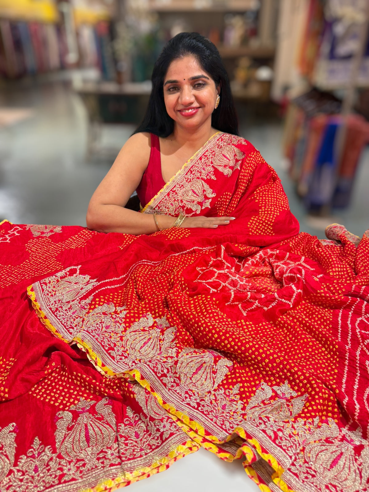 Orangish Red Designer Rai Bandhej Saree With Embroidered Border