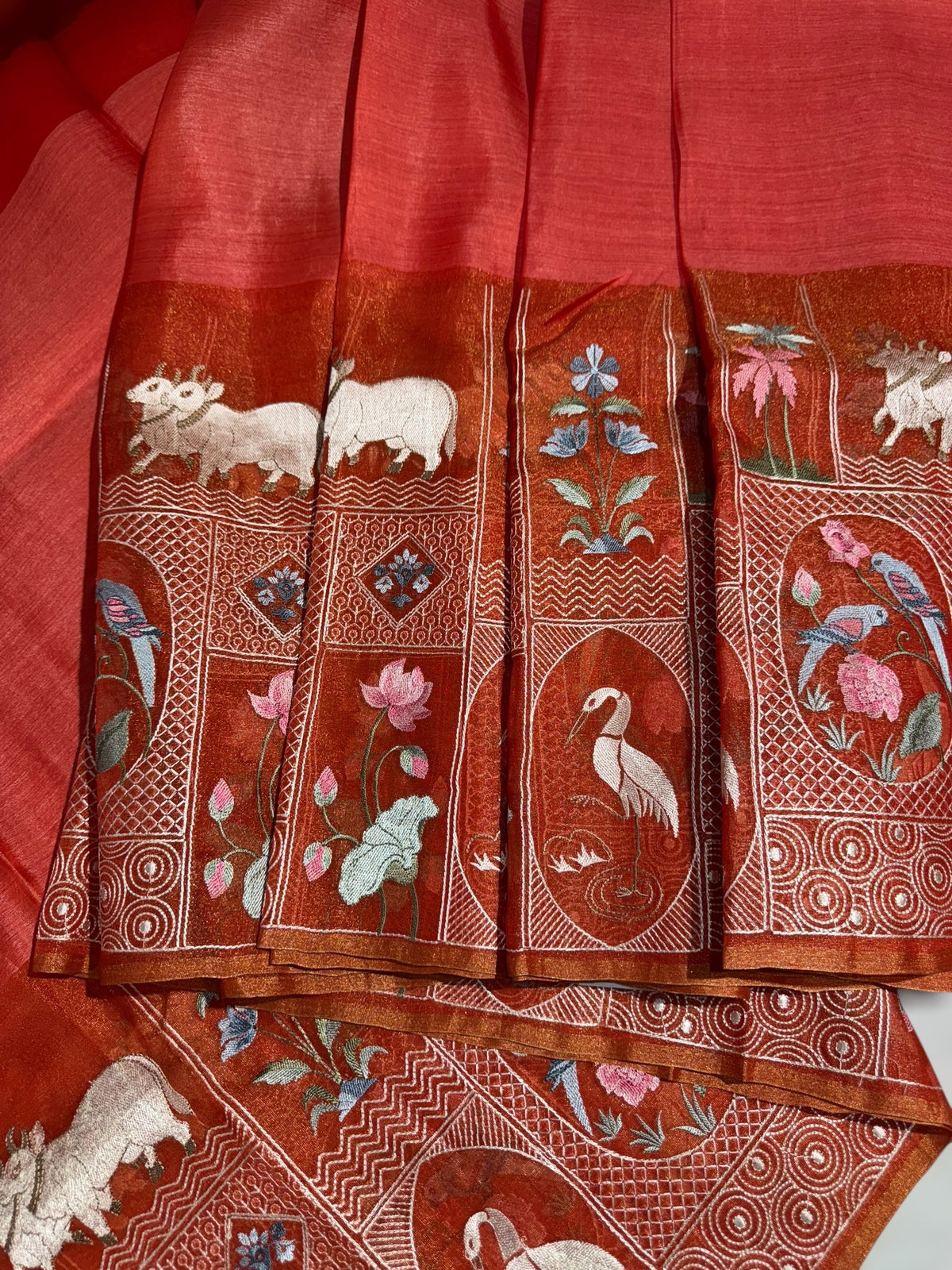 Reddish Orange Kora-Tussar blend Handloom Saree with Tissue embroidered Skirt Border