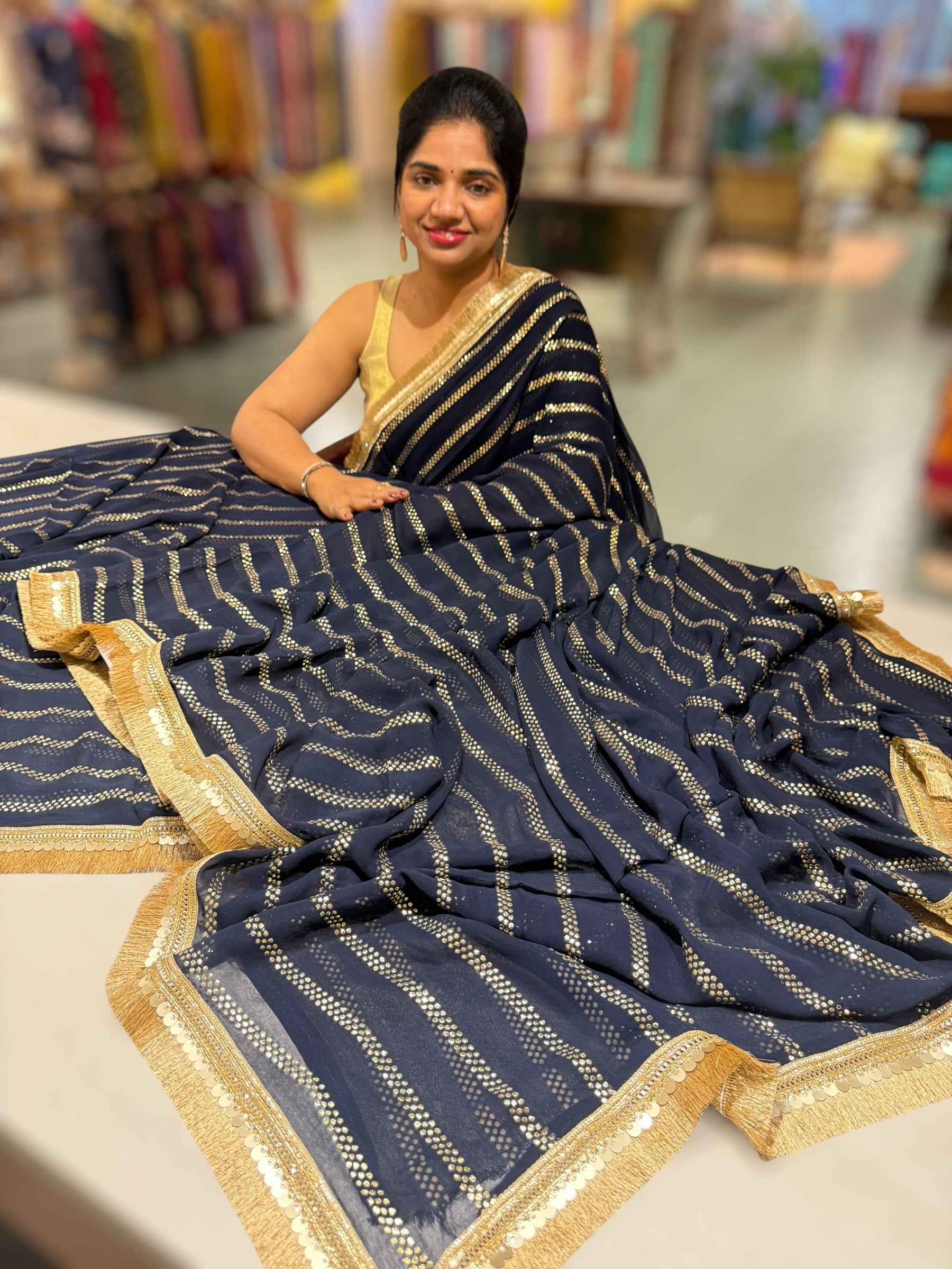 Navy Blue Georgette Saree with stick on Badla in stripes pattern and kiran Lace
