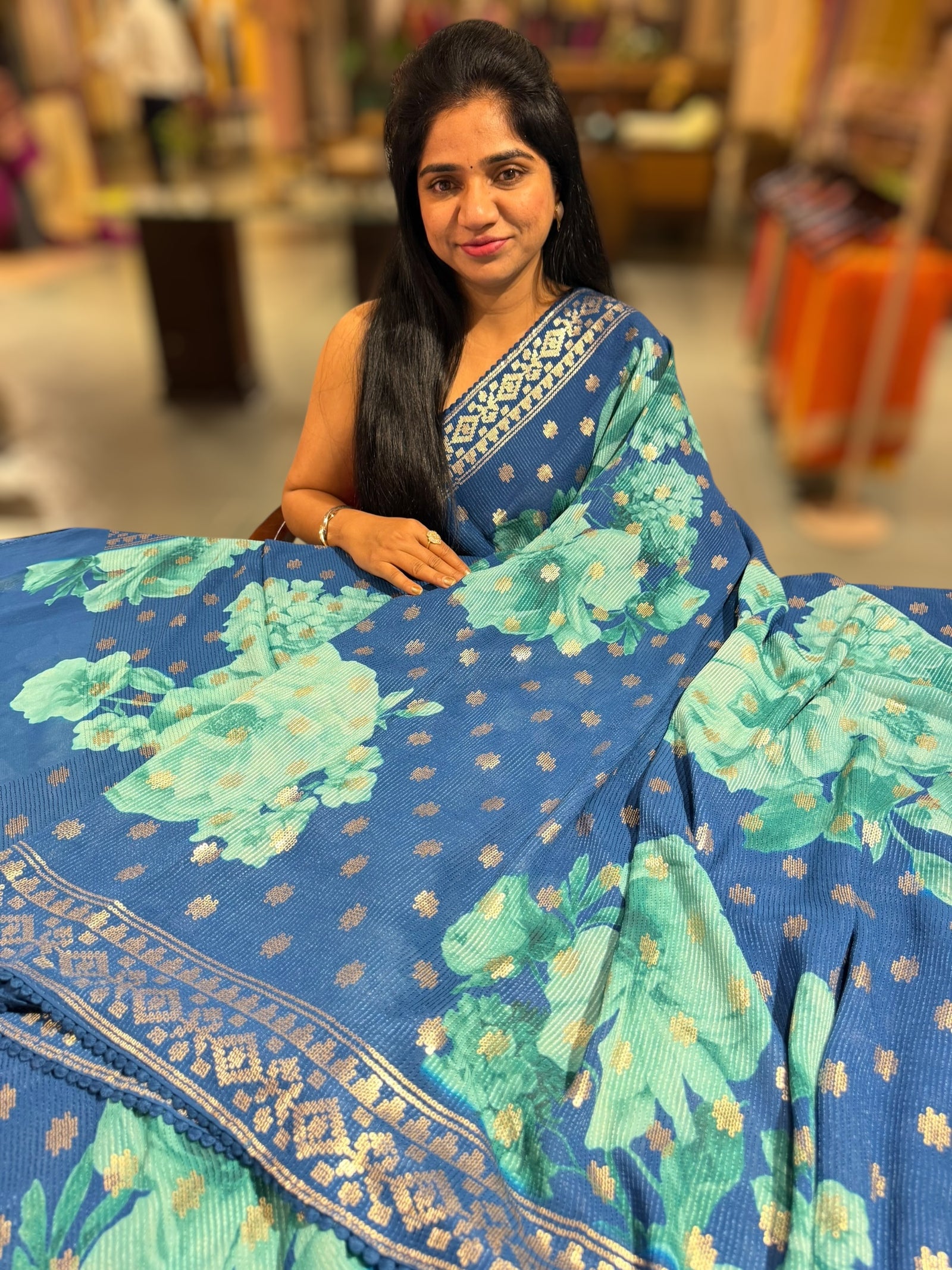 Blue georgette sequence saree with statement floral print