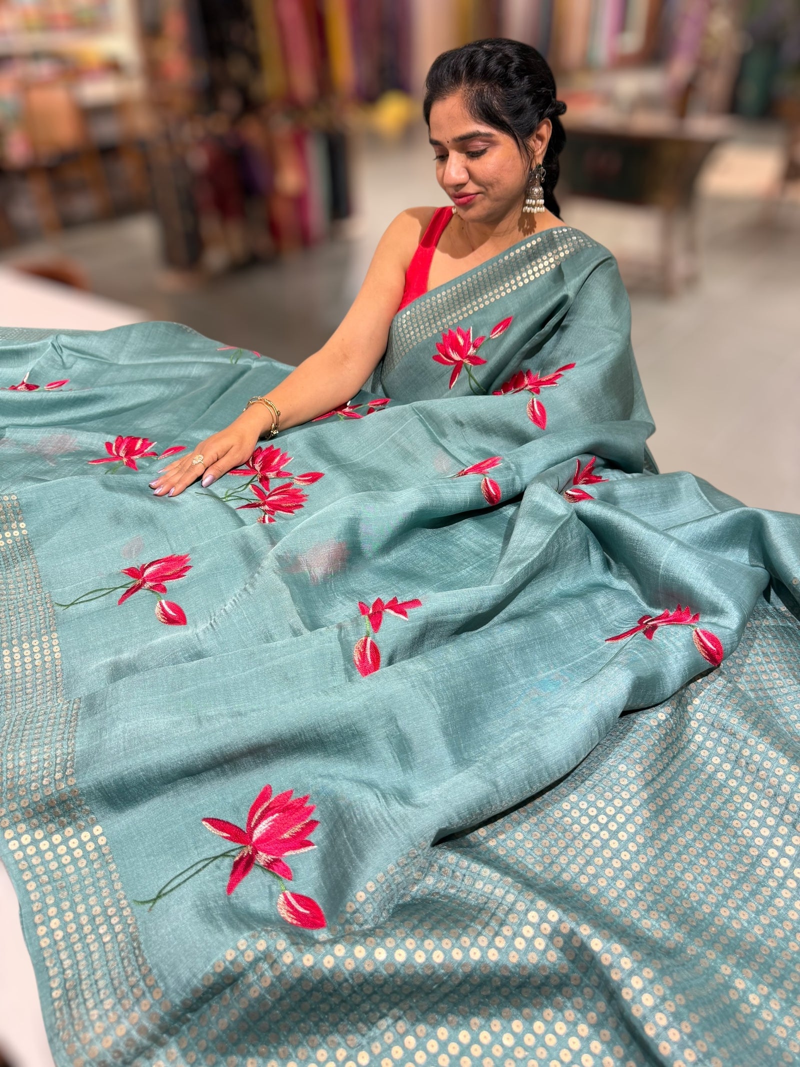 Teal pure handloom tussar byloom saree with lotus embroidered bunch motifs