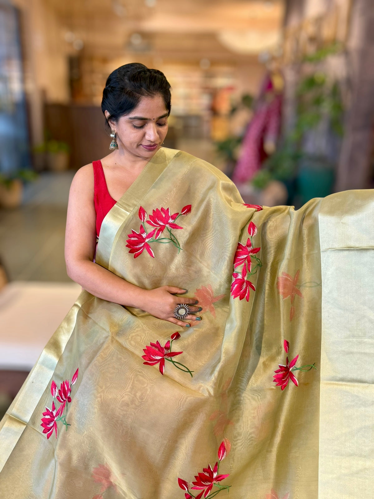 Olive Green Organza Saree with Lotus flower embroidery and Satin Borders.