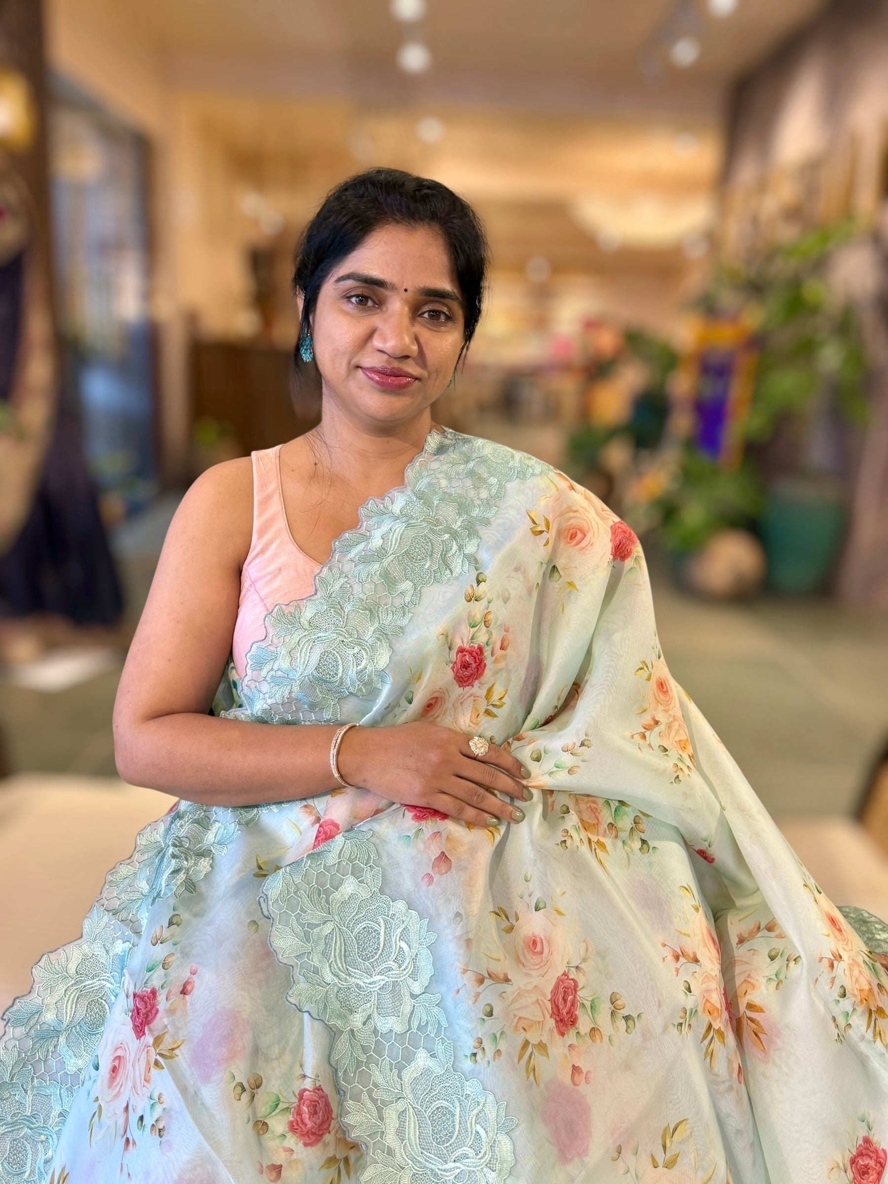 SeaBlue Printed Organza Saree With Chantilly Lace Style Embroidered Border.