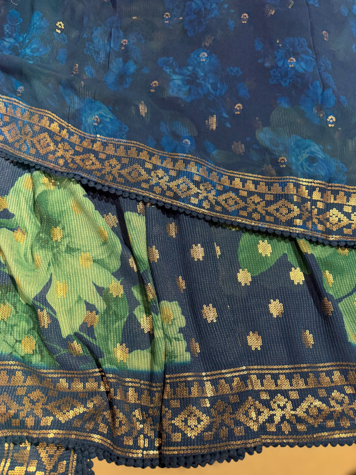 Blue georgette sequence saree with statement floral print