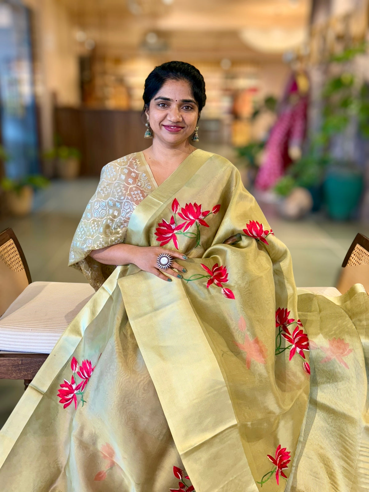 Olive Green Organza Saree with Lotus flower embroidery and Satin Borders.