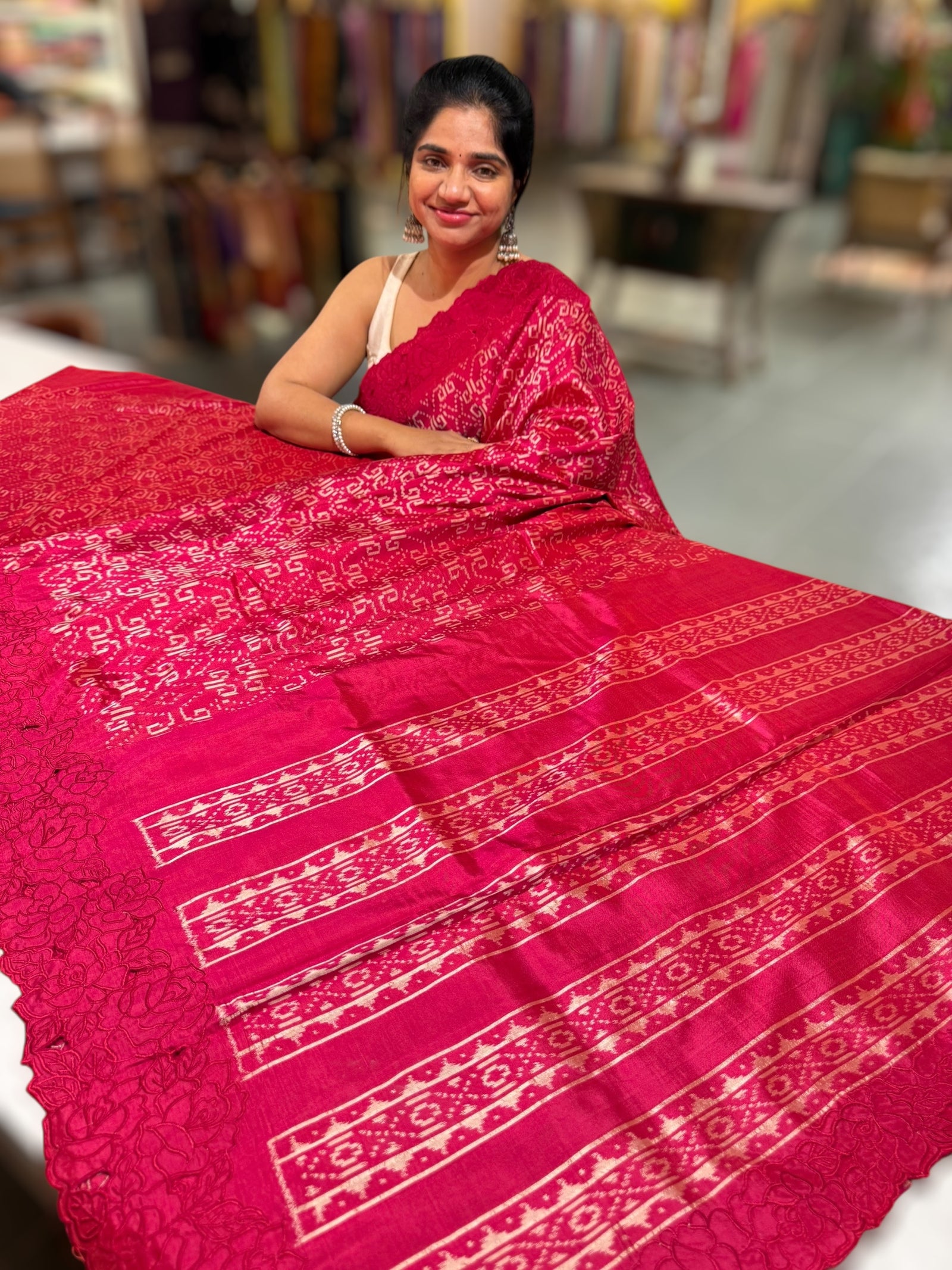 Reddish Pink Cambodian–inspired Ikkat Silk Saree with cutwork Rose Border