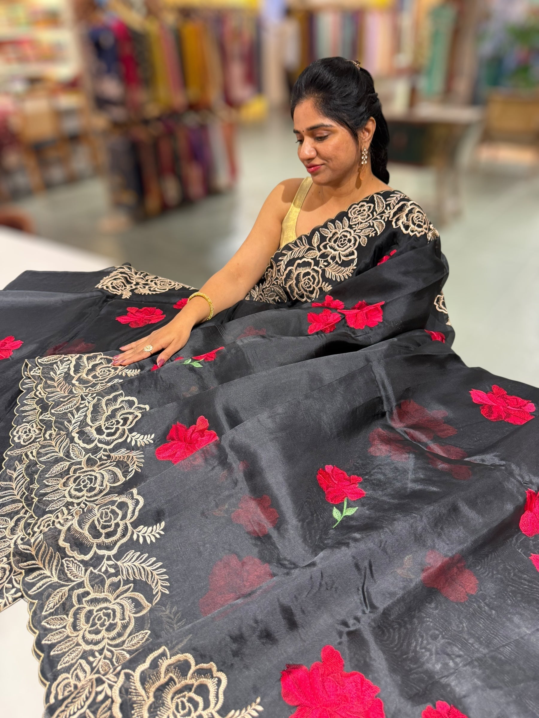 Black Organza Saree with stunning outline floral embroidered cytwork border and red hibuscus flowers allover