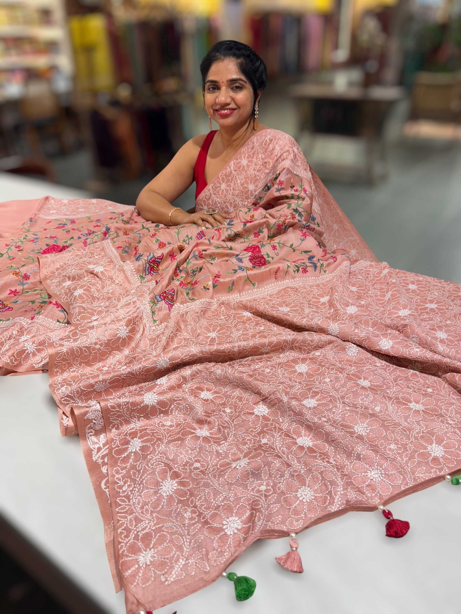 Peach Pink Tussar Saree with lucknowi border and pallu with allover petite point embroidery.