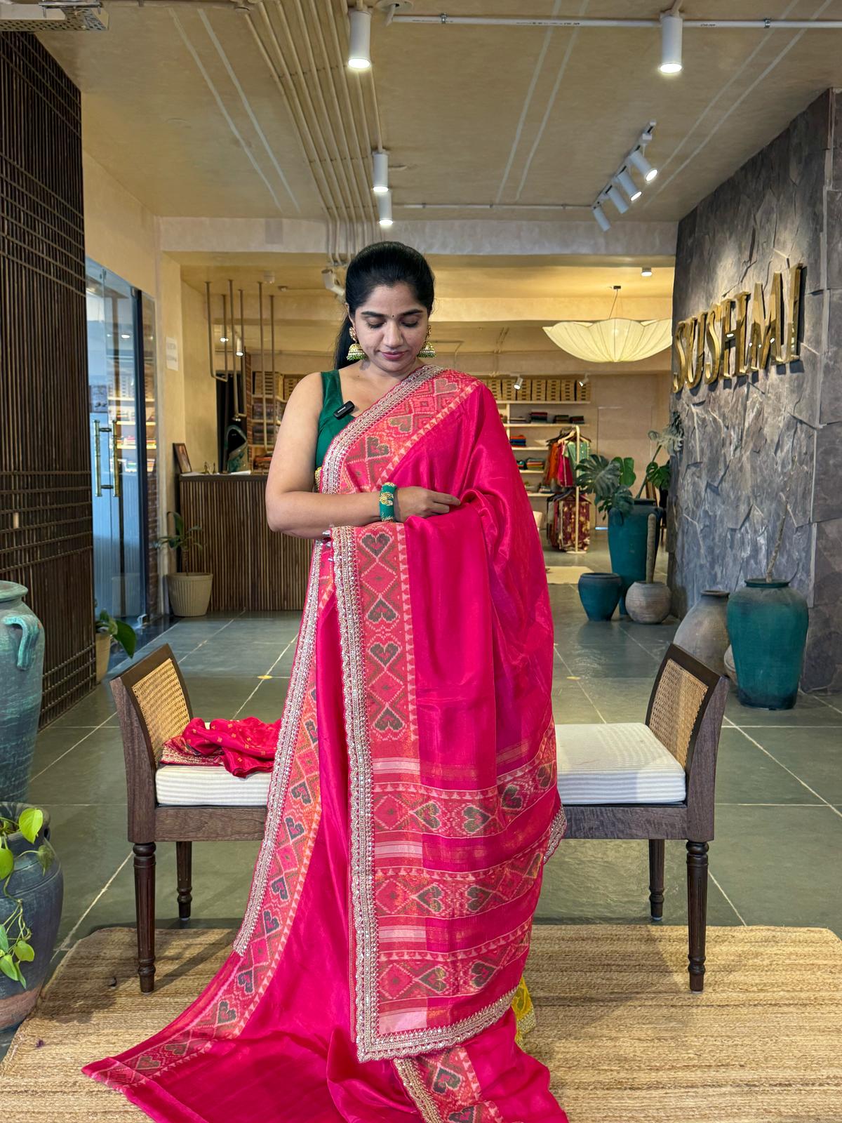 Rani pink falling Tussar silk saree with Patola borders and Sabhyasachi-style