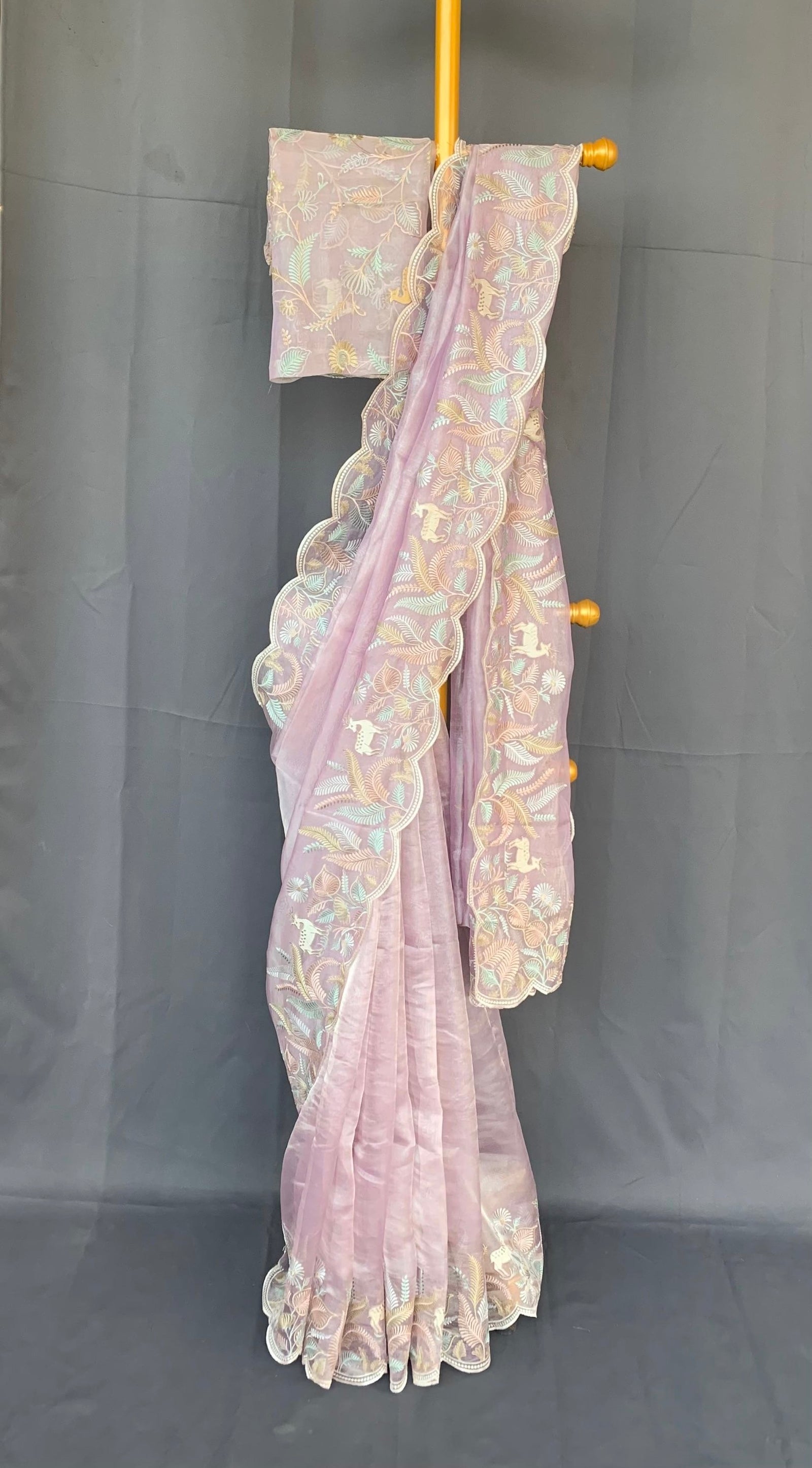 Lilac  Tissue Designer Saree with by heavy embroidered Borders  .