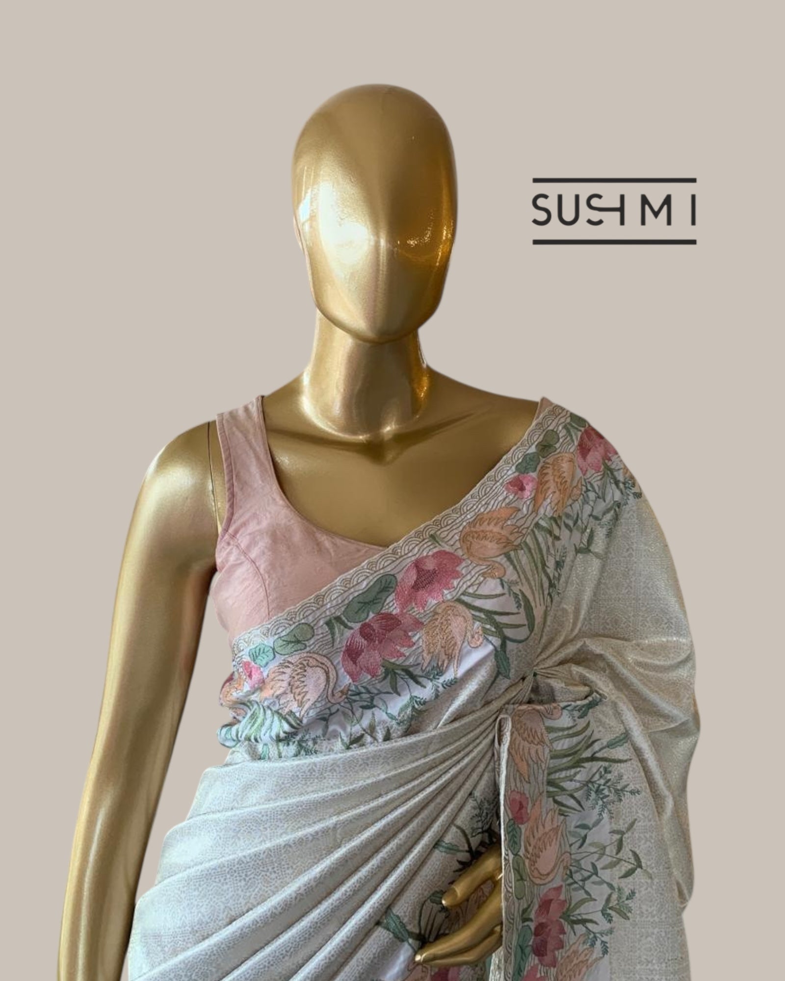 White Kanjeevaram Brocade Saree With Beautiful Pond Theme Embroidered Border.