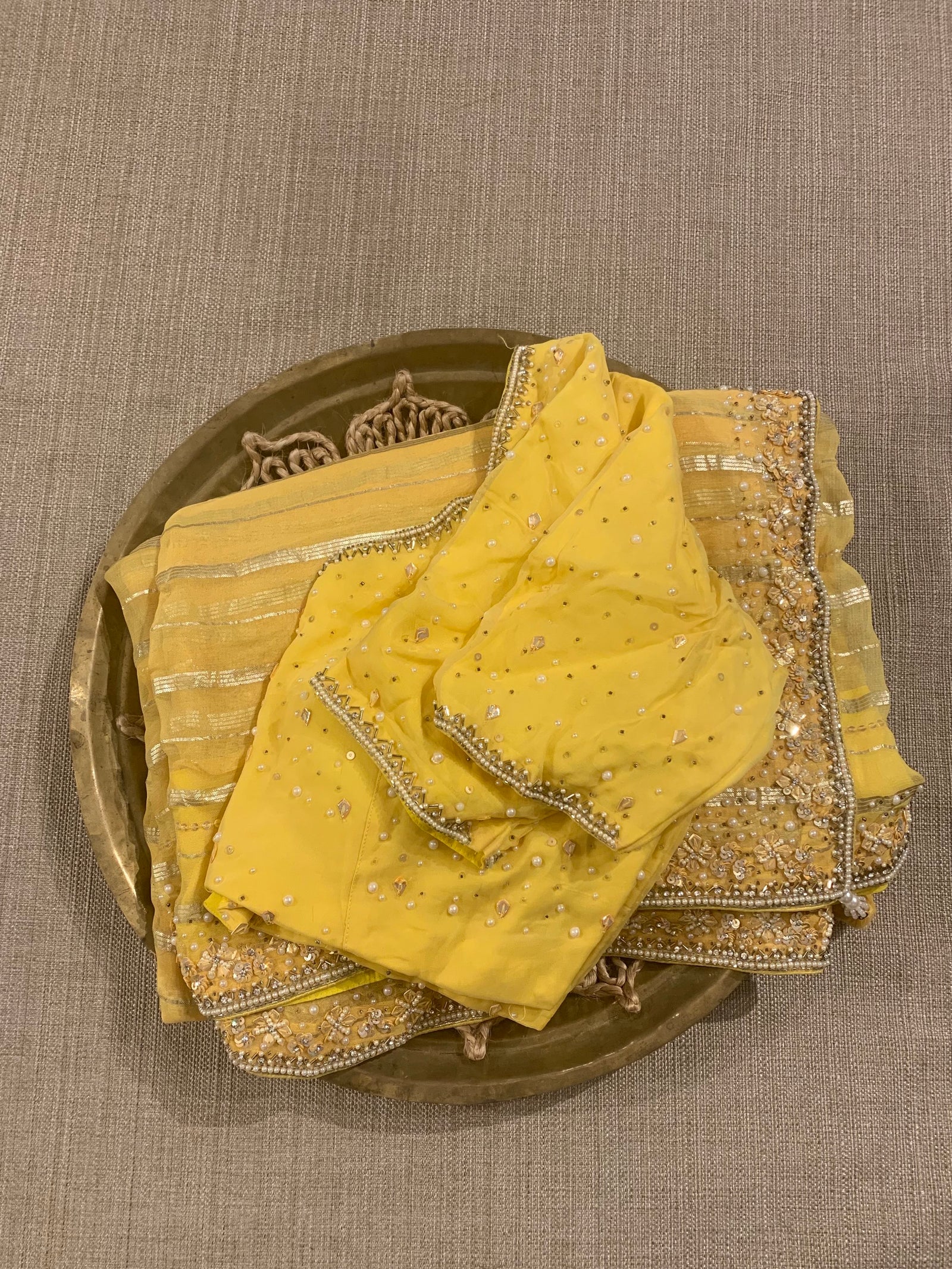 Yellow shaded Chiffon Saree  with  golden stripes , handwork on saree Blouse