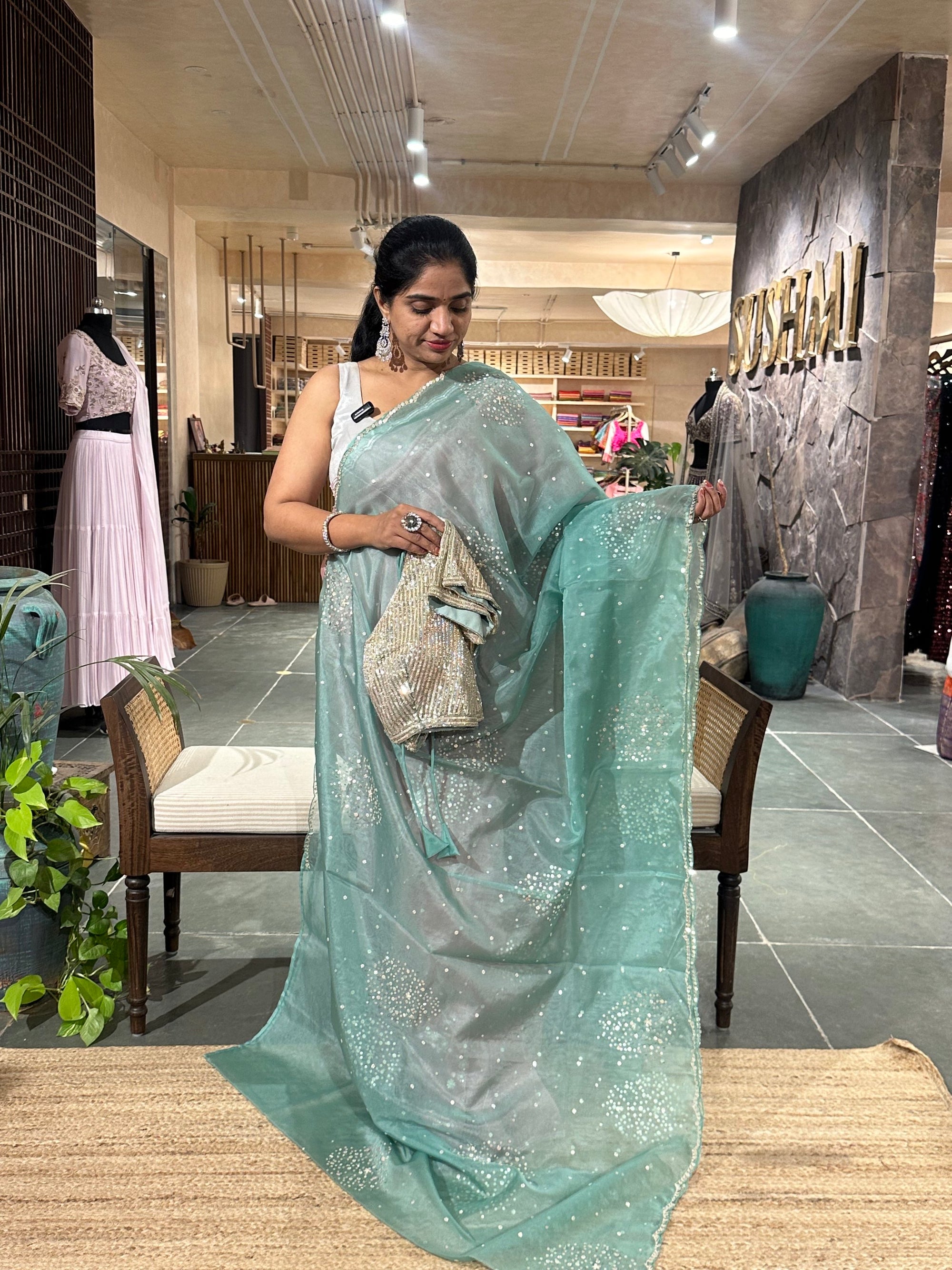 Sea Green Organza Saree with allover work and paired with heavy blouse