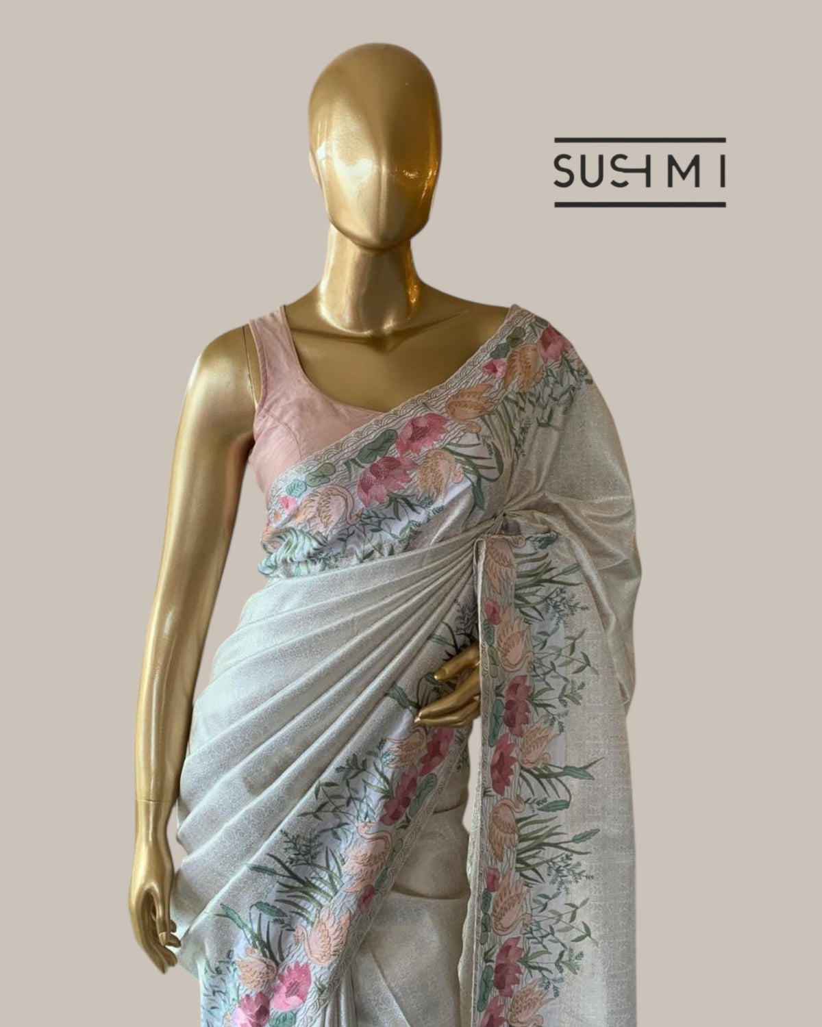 White Kanjeevaram Brocade Saree With Beautiful Pond Theme Embroidered Border.